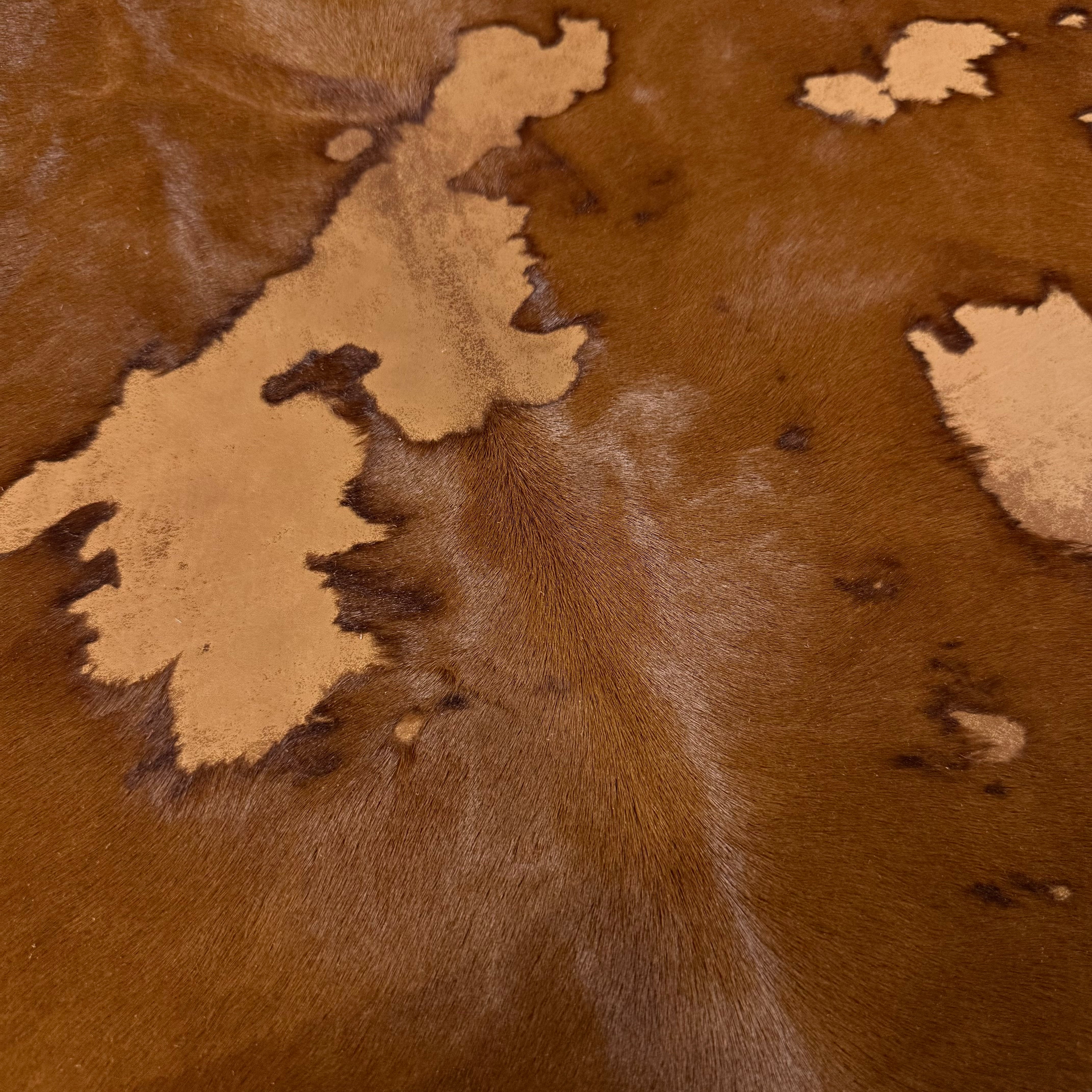 Acid Wash Cavallino Hair-On Calf leather with two-tone rust burnout effect and natural spotting.