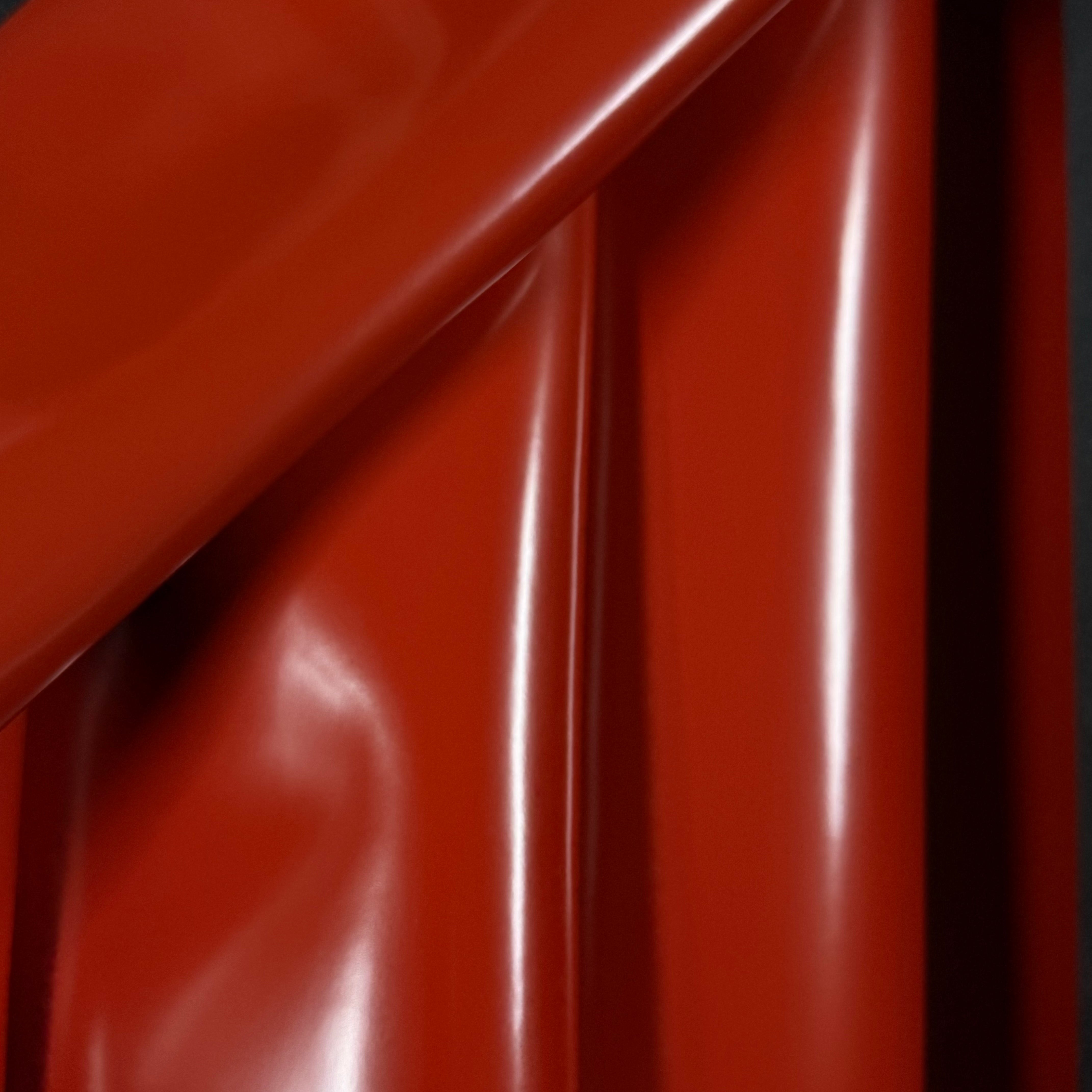 Smooth, polished red cowhide leather with a high-gloss finish and subtle folds.