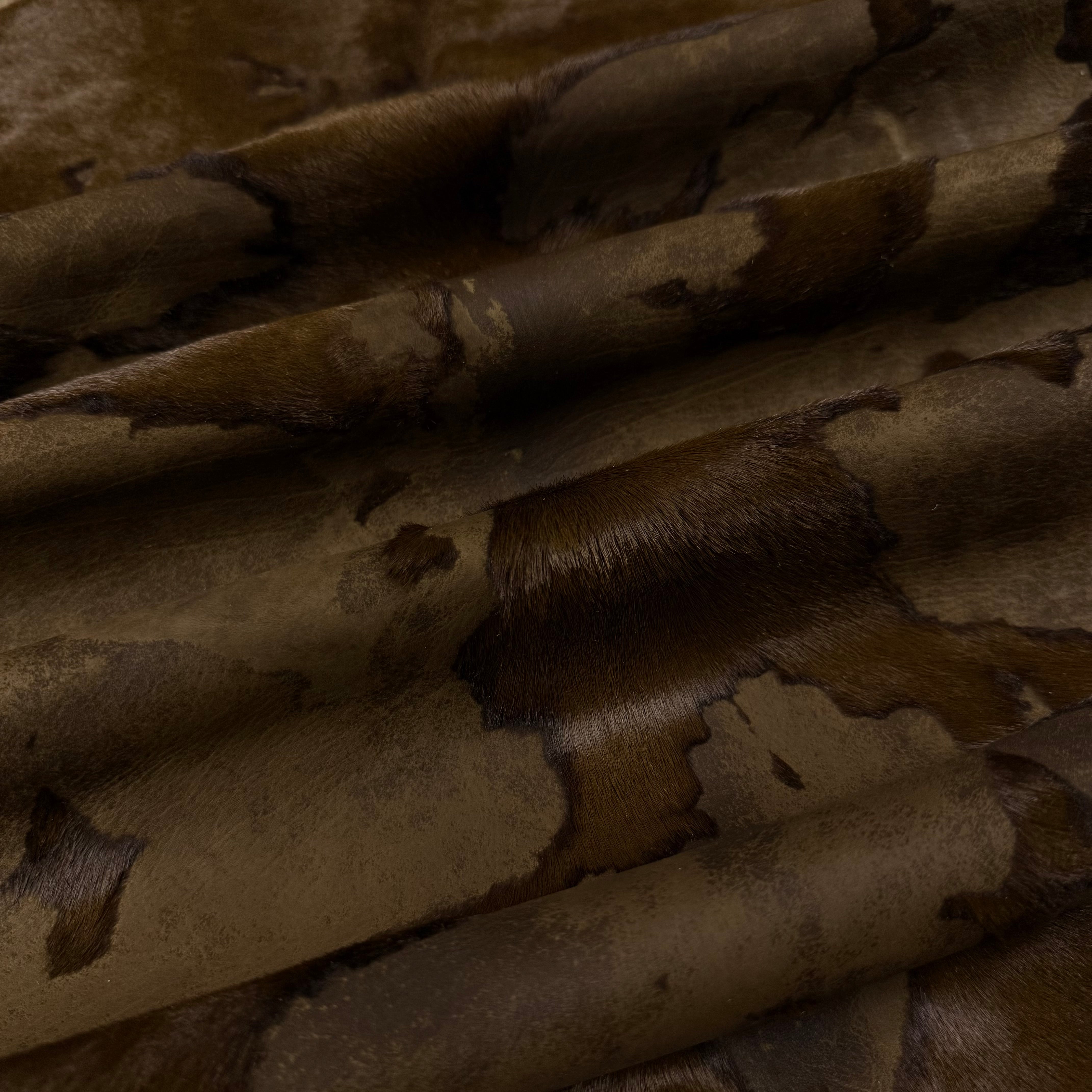 Acid Wash Cavallino Hair-On Calf leather in a two-tone rust burnout effect with natural spotting.