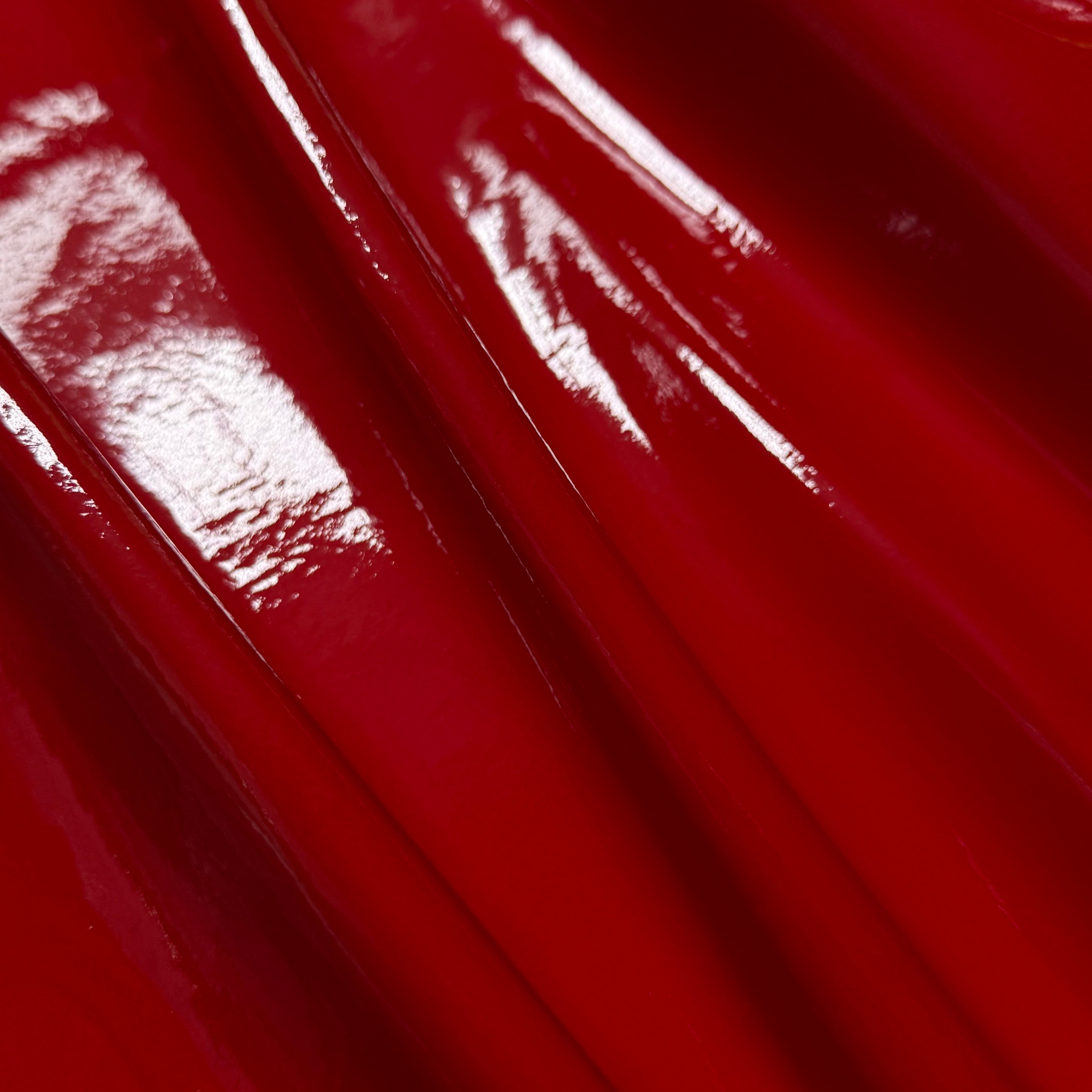 Patent Pig 1-2 oz in glossy red, featuring a smooth, reflective patent leather texture with elegant folds.