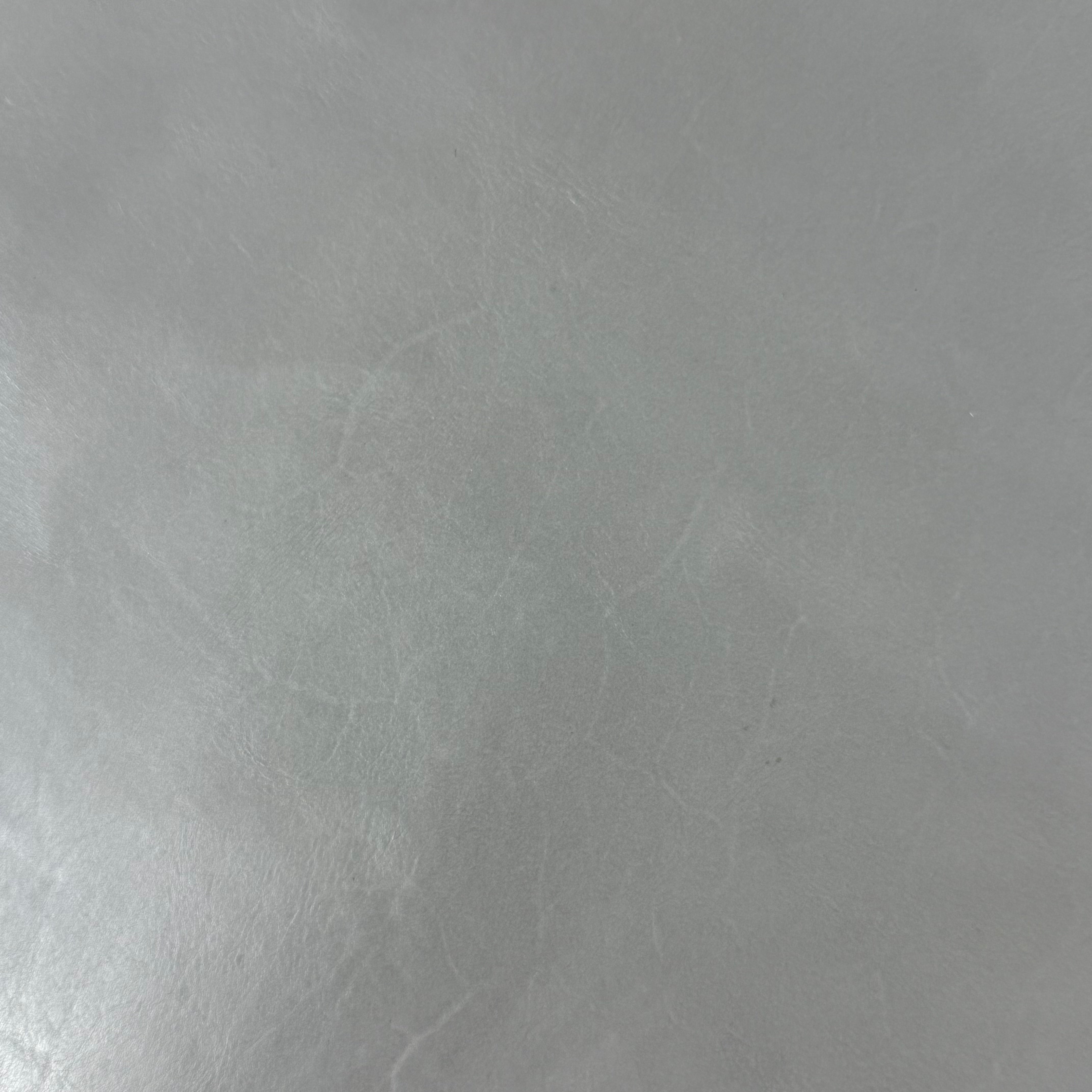 Smooth gray vegetable-tanned baby calf leather with subtle natural texture and polished aniline finish.