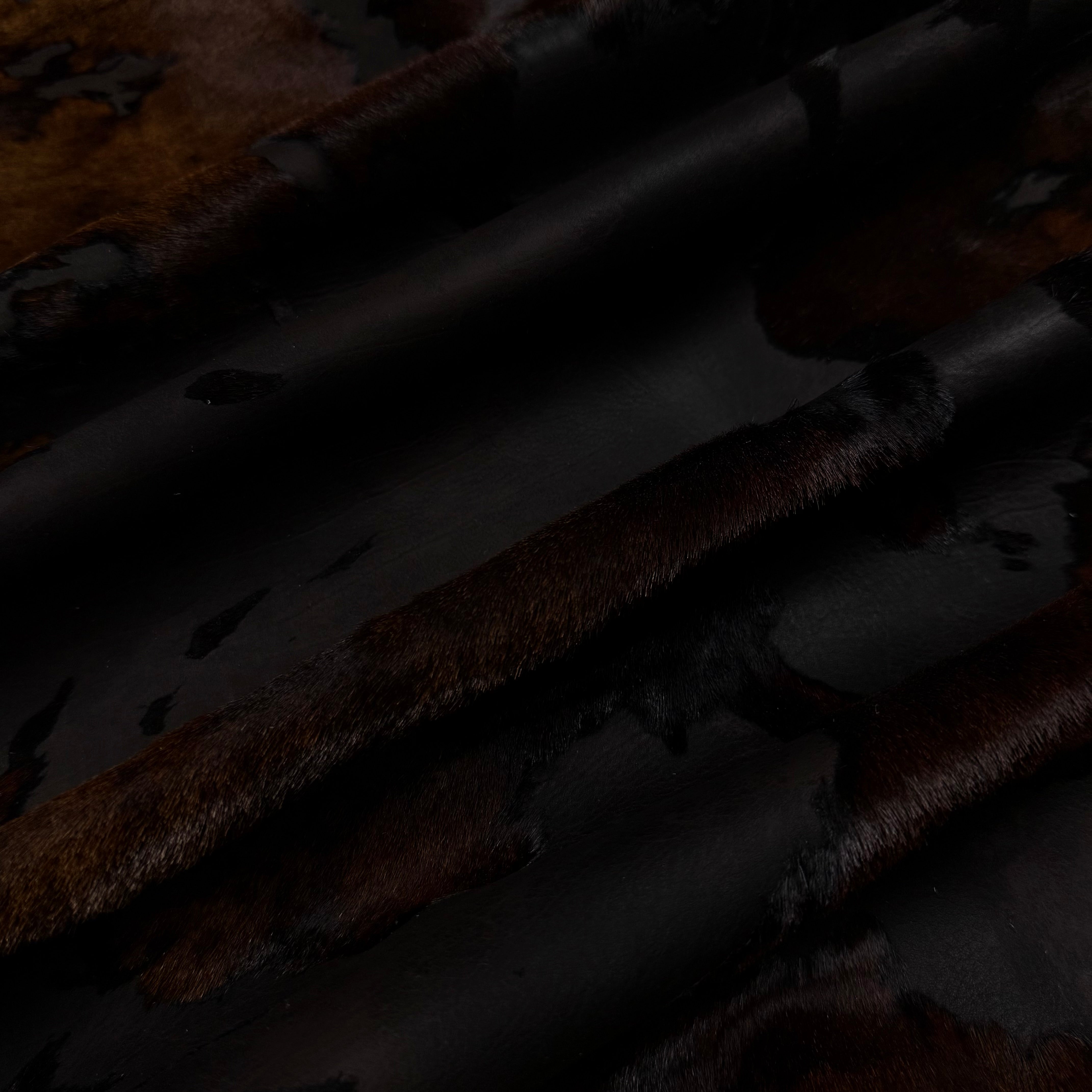 Acid Wash Cavallino Hair-On Calf leather in a dark two-tone rust burnout effect with natural spotting.