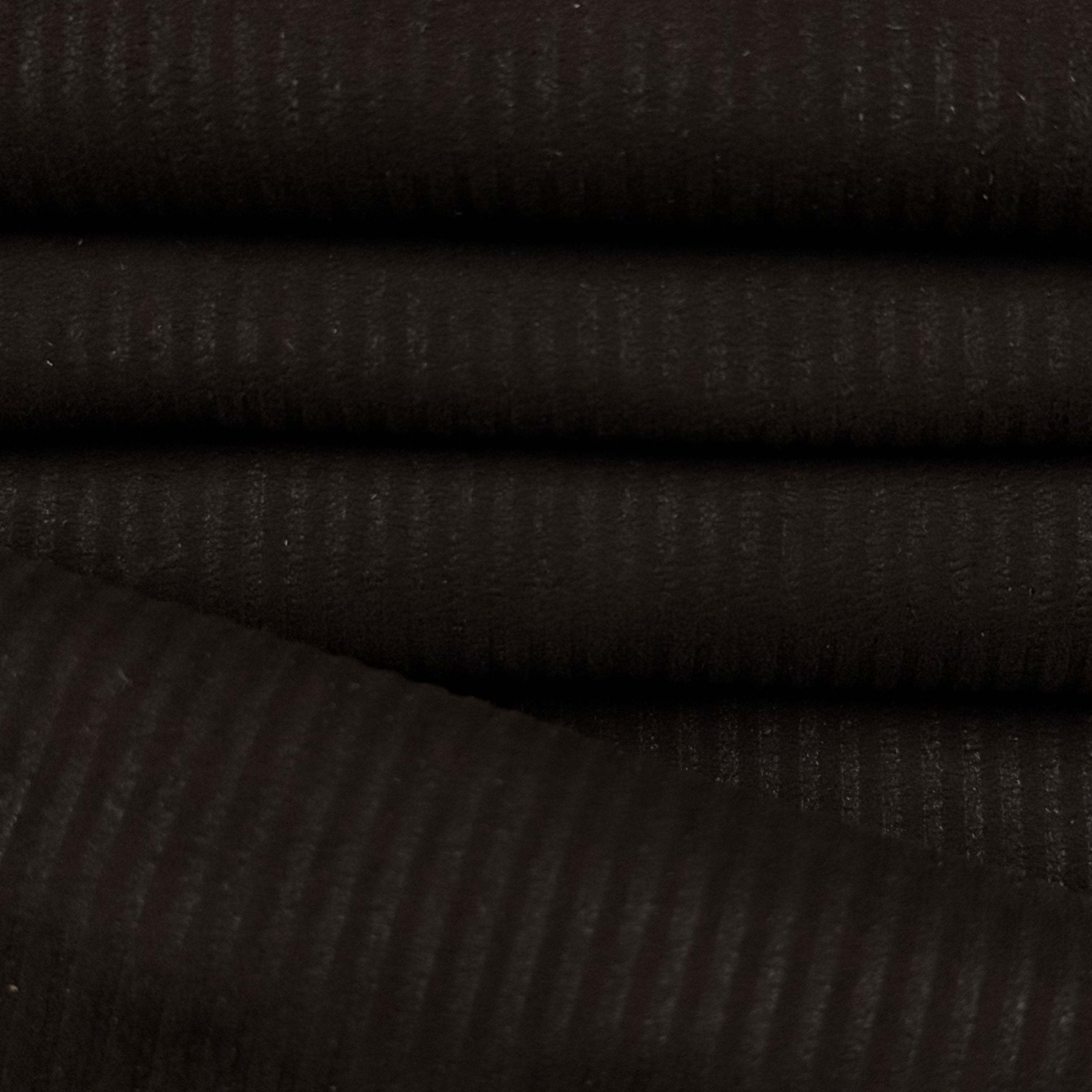 Dark brown corduroy Metis lamb suede with a ribbed texture, folded.