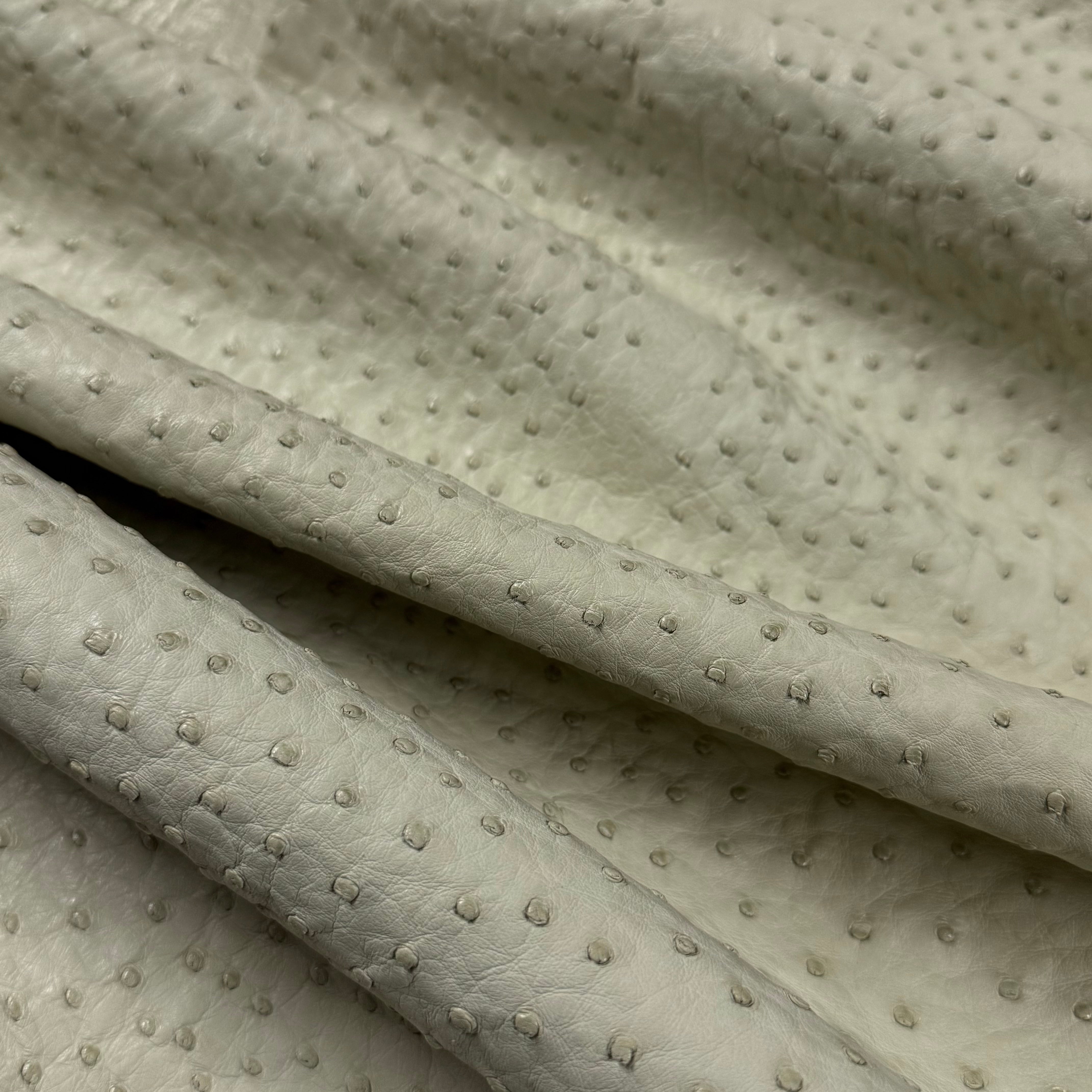Cream full quill genuine ostrich leather with a natural, raised quill pattern.