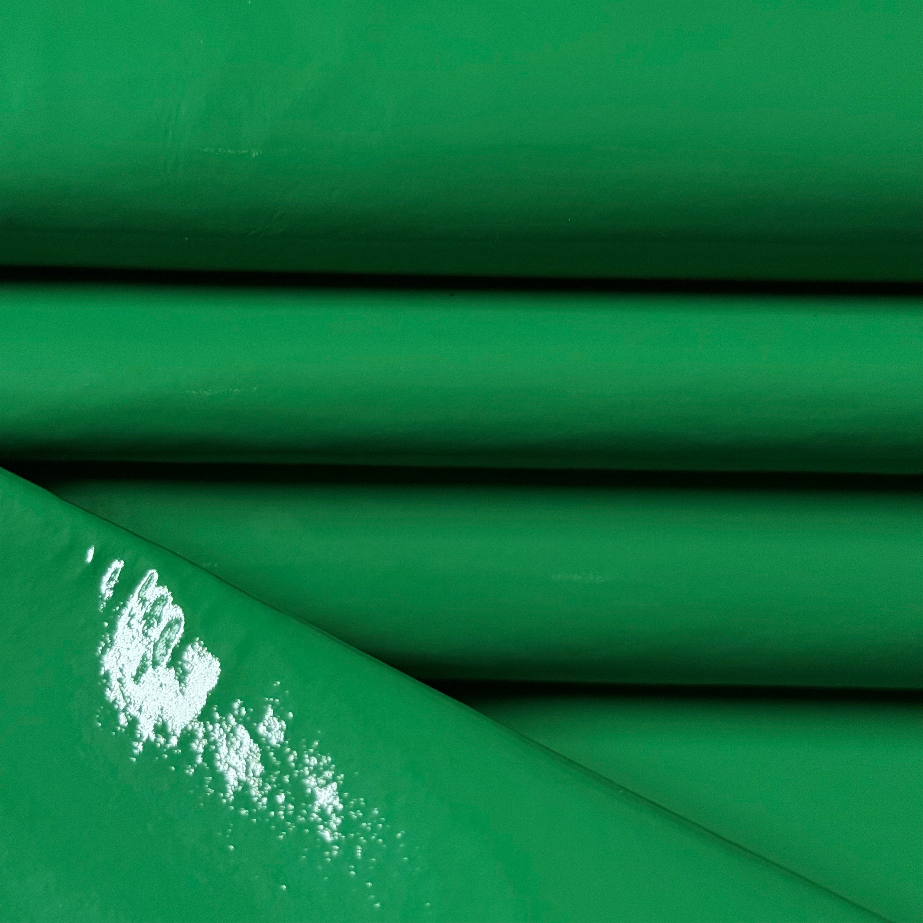 Green Patent Pig leather, 1-2 oz weight, featuring a smooth, glossy finish with soft folds and light reflection.