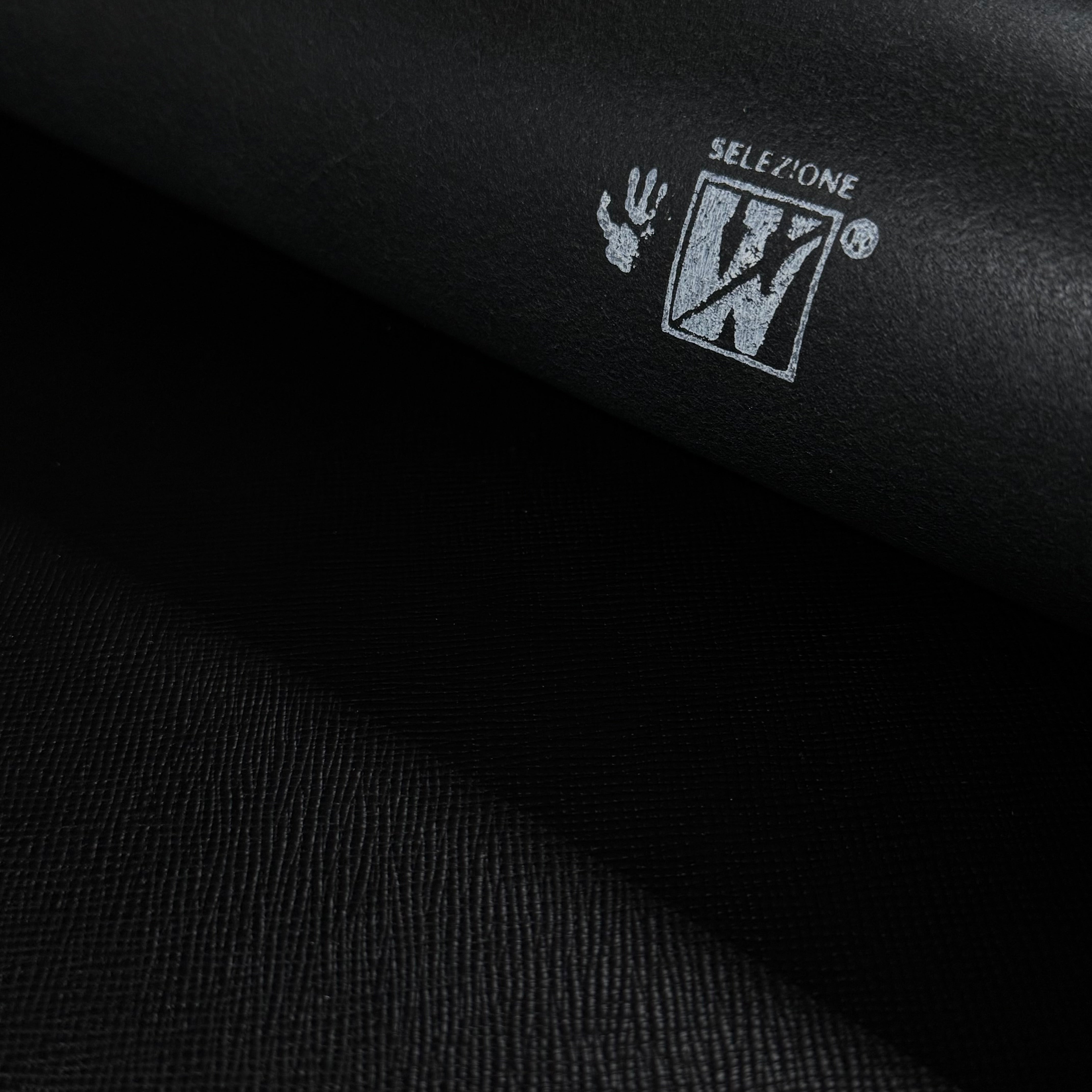 Black Conceria Walpier Hatch Buttero leather with a subtle embossed texture and white "SELEZIONE W" logo.
