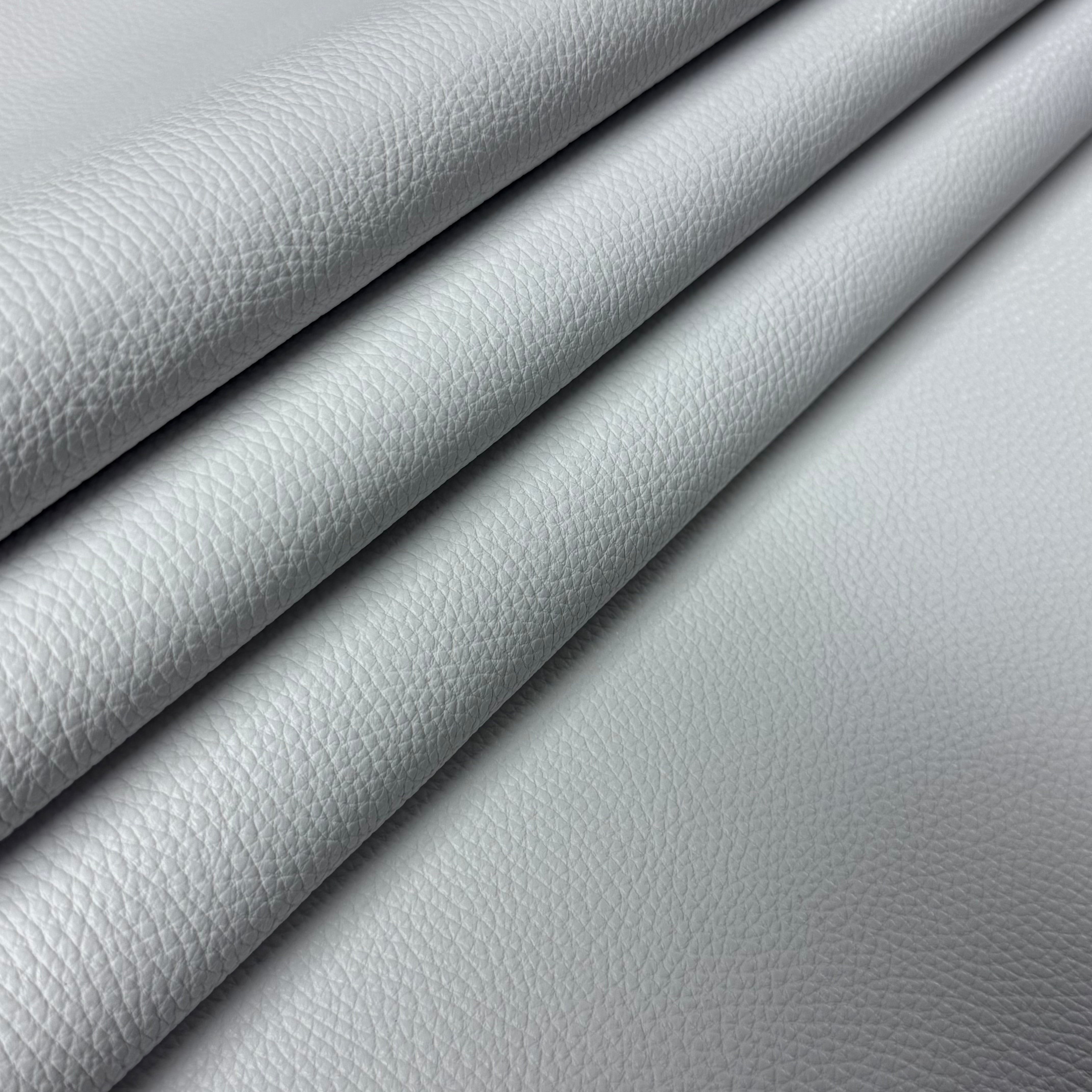Light grey Pebble Grain Calf leather, 3-4 oz weight, featuring a textured, durable finish folded in layers.