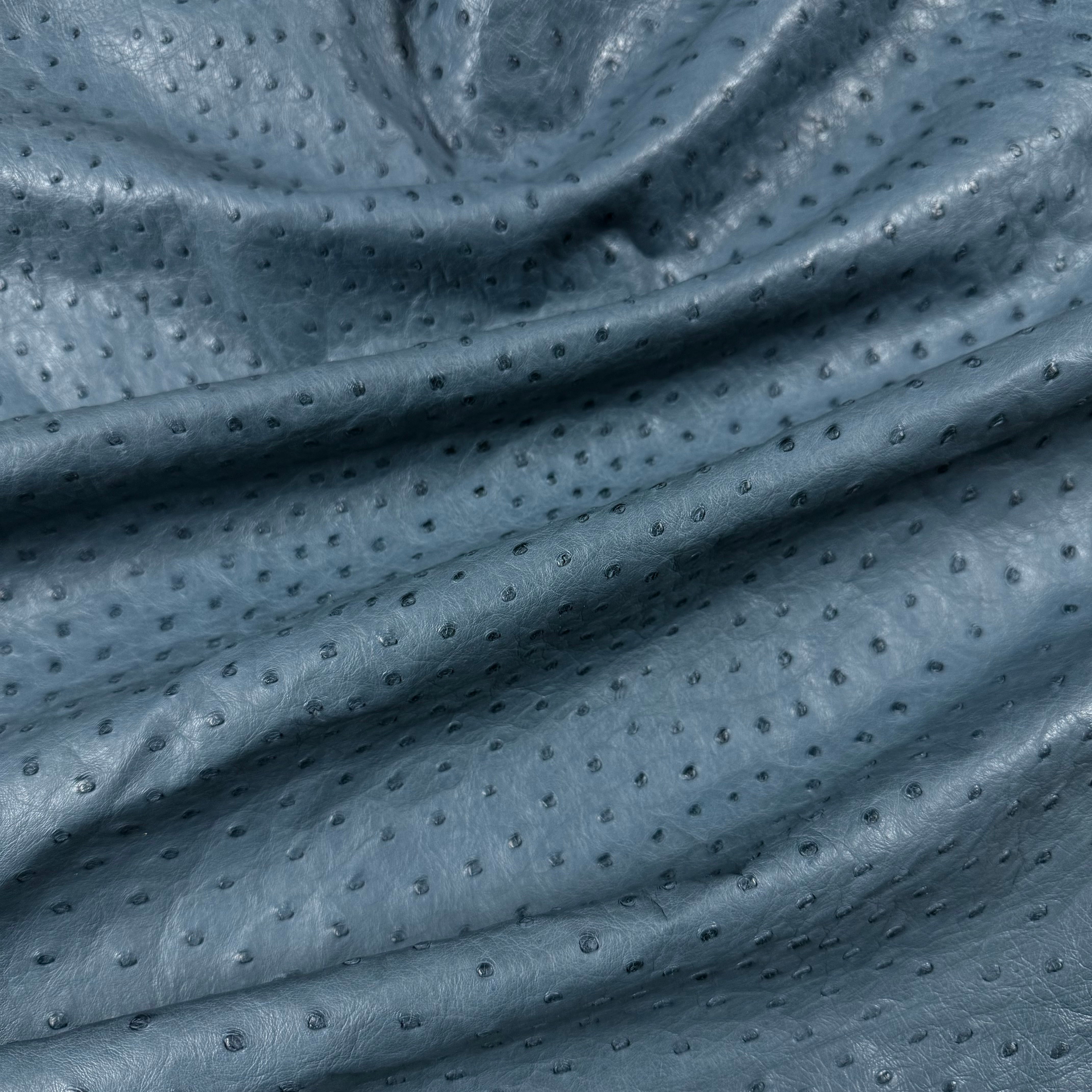 Wrinkled blue full quill genuine ostrich leather with natural texture.