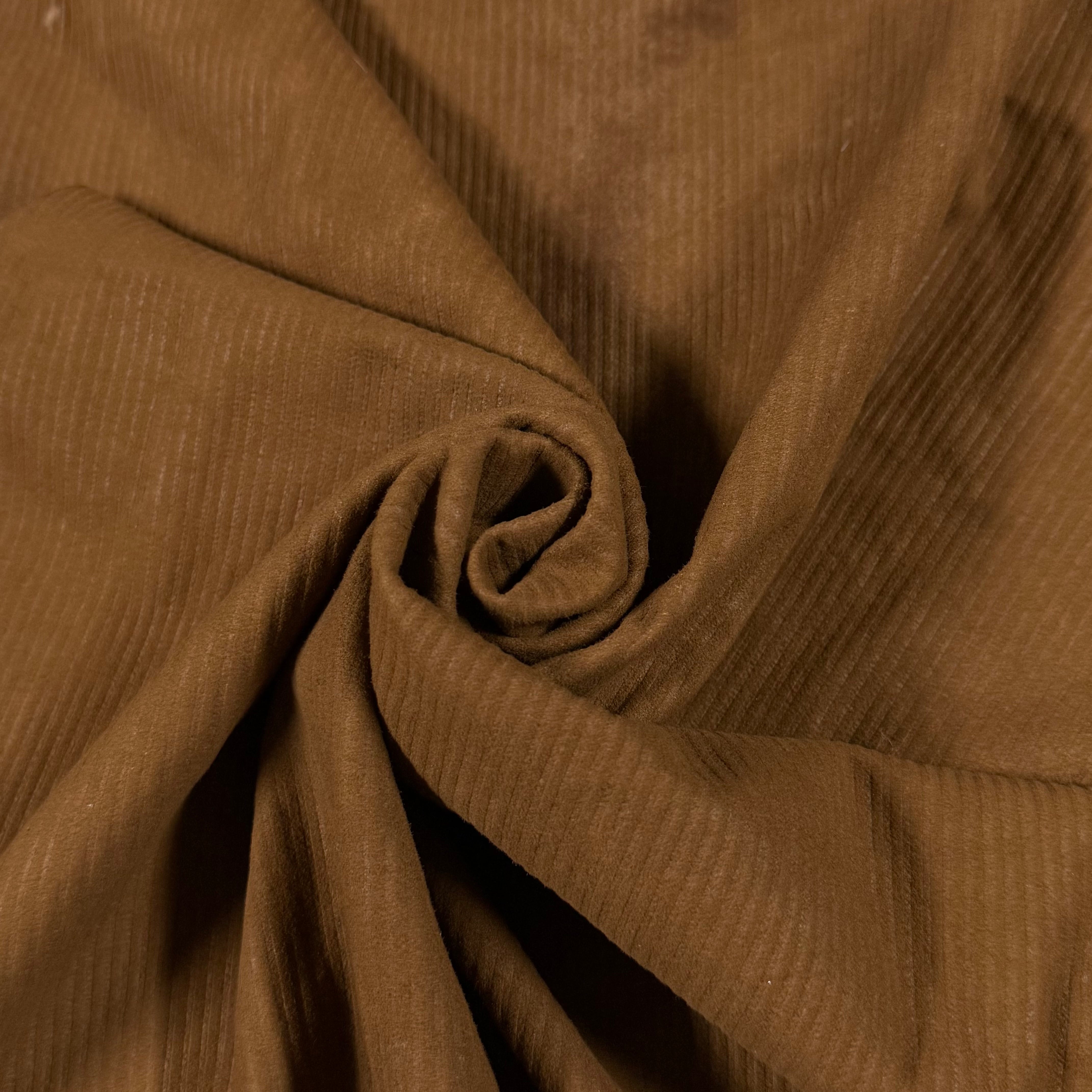 Brown corduroy Metis lamb suede with a ribbed texture, folded into a spiral.