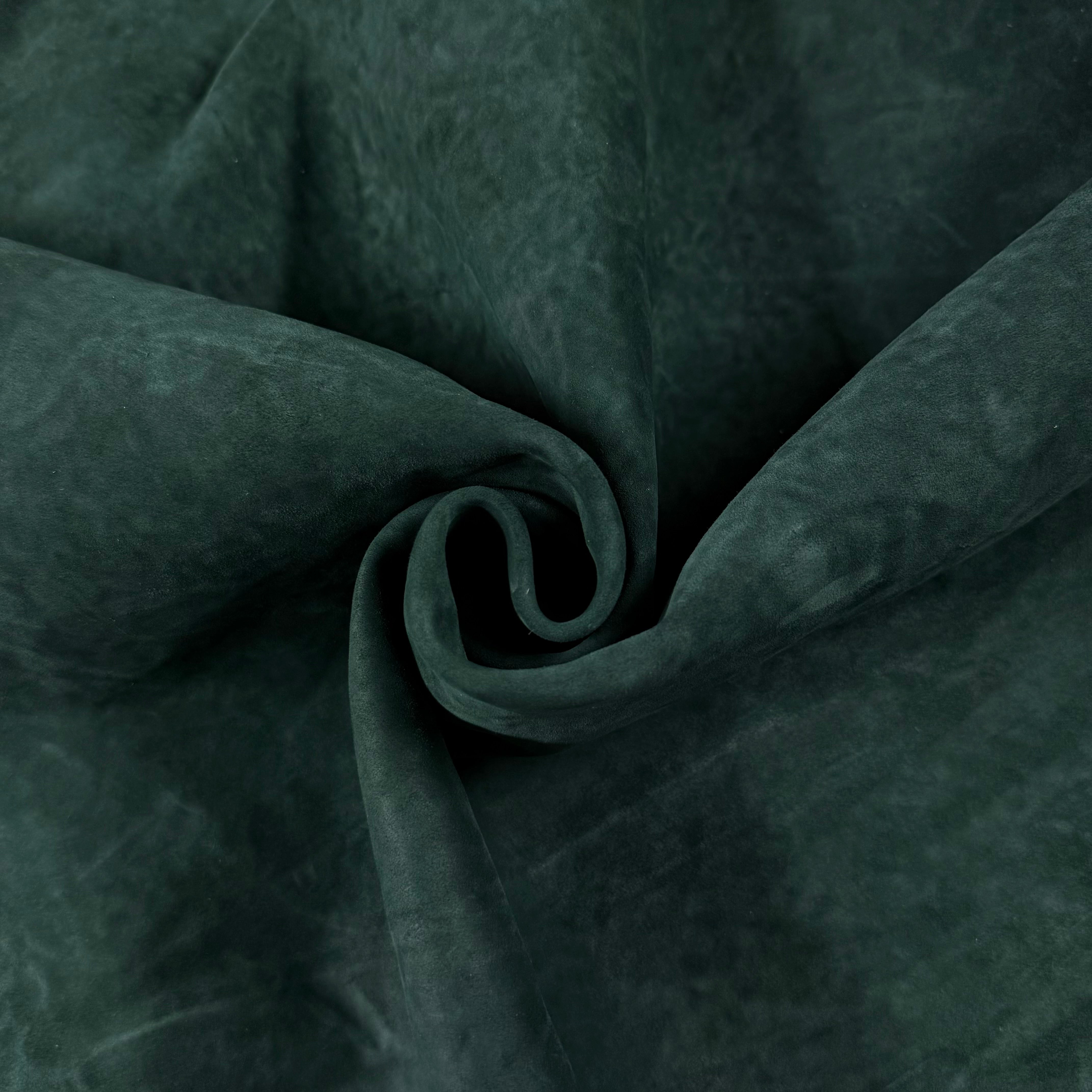 Dark green Conceria Incas Italian Water Calf leather, soft and suede-like, with gentle folds.