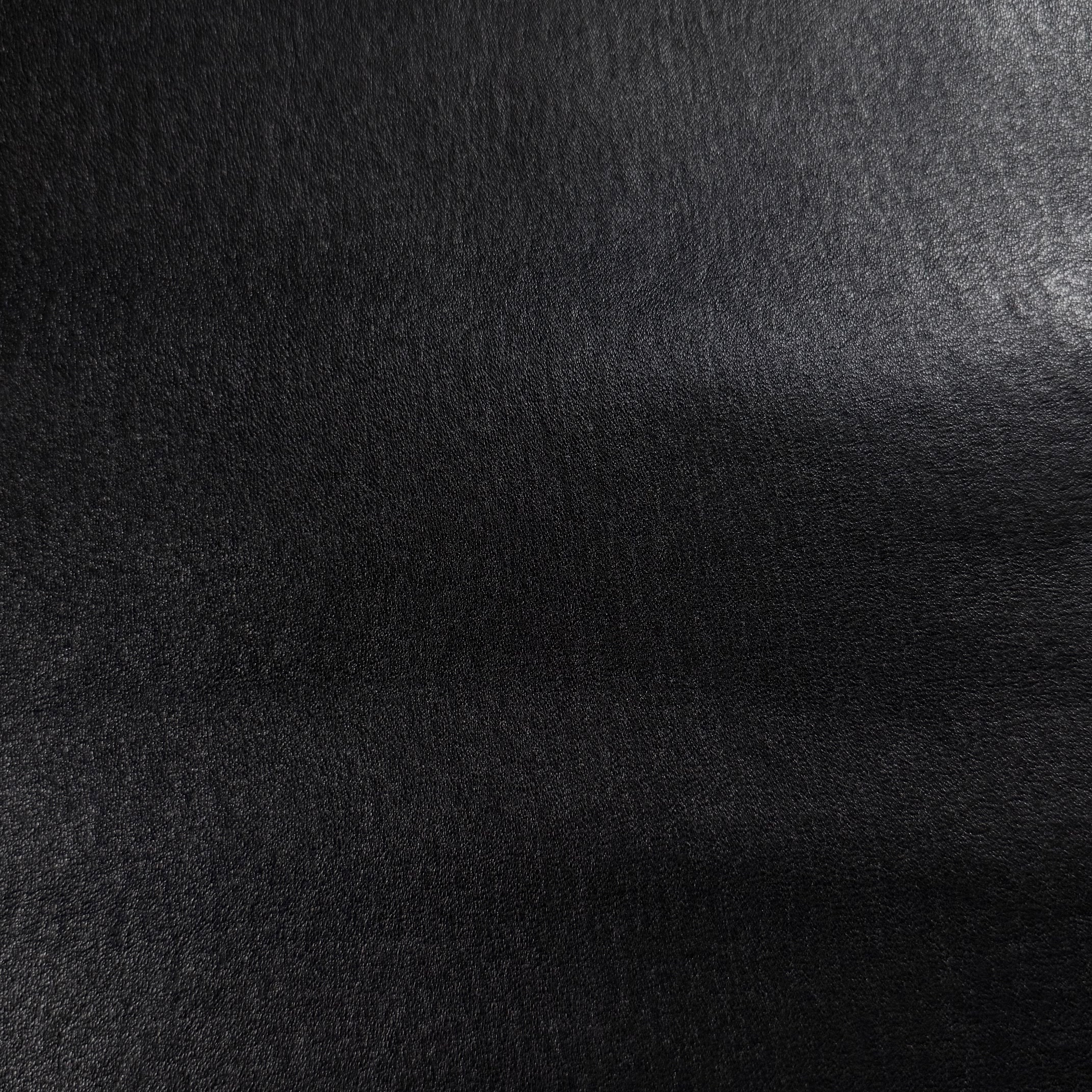 Black Italian stretch nappa lamb leather with a smooth, semi-aniline finish and slight sheen.
