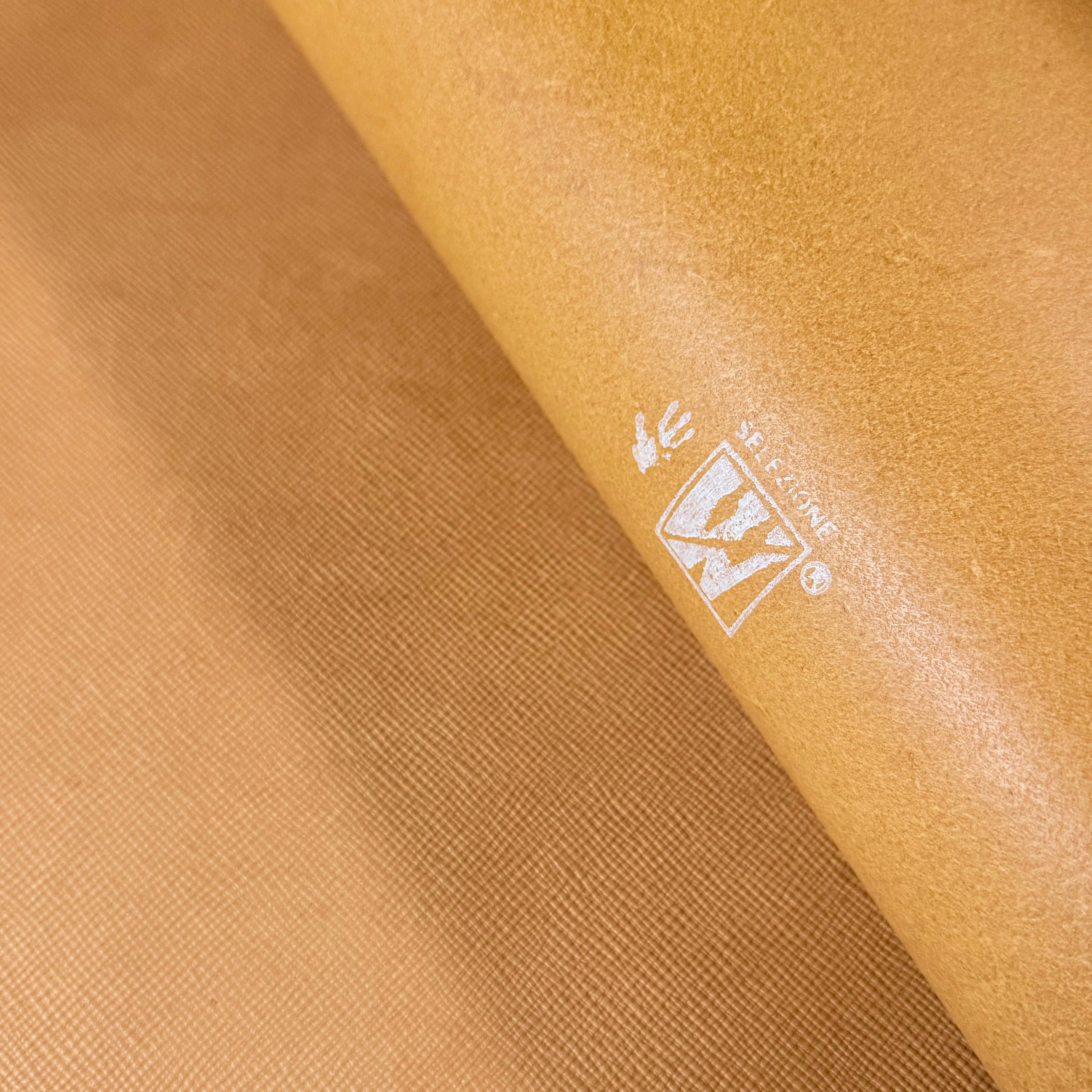 Natural Conceria Walpier Hatch Buttero vegetable tanned cow leather with embossed texture and logo.