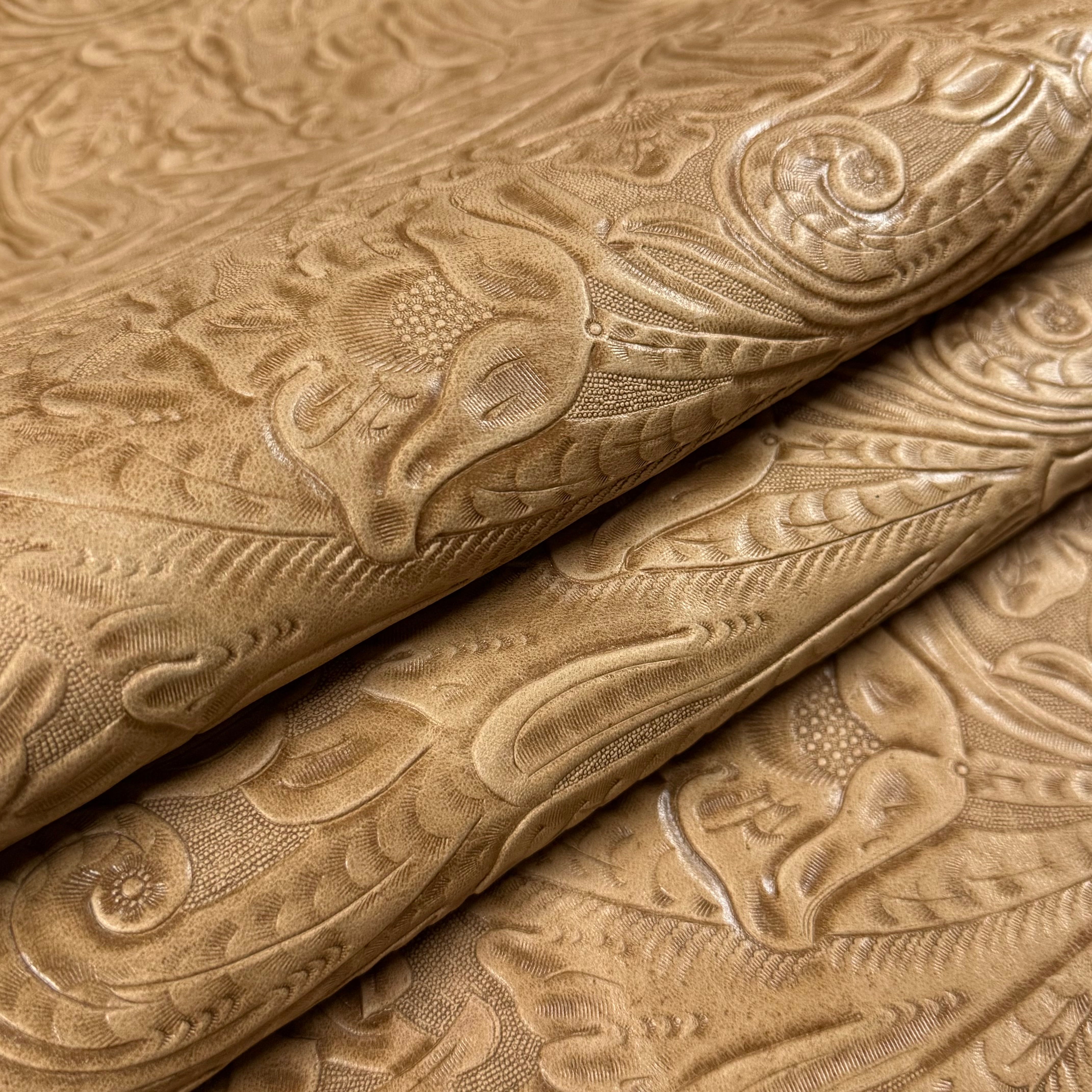 Rolled light brown floral embossed oiled veg tan lamb leather with a detailed Sheridan pattern.