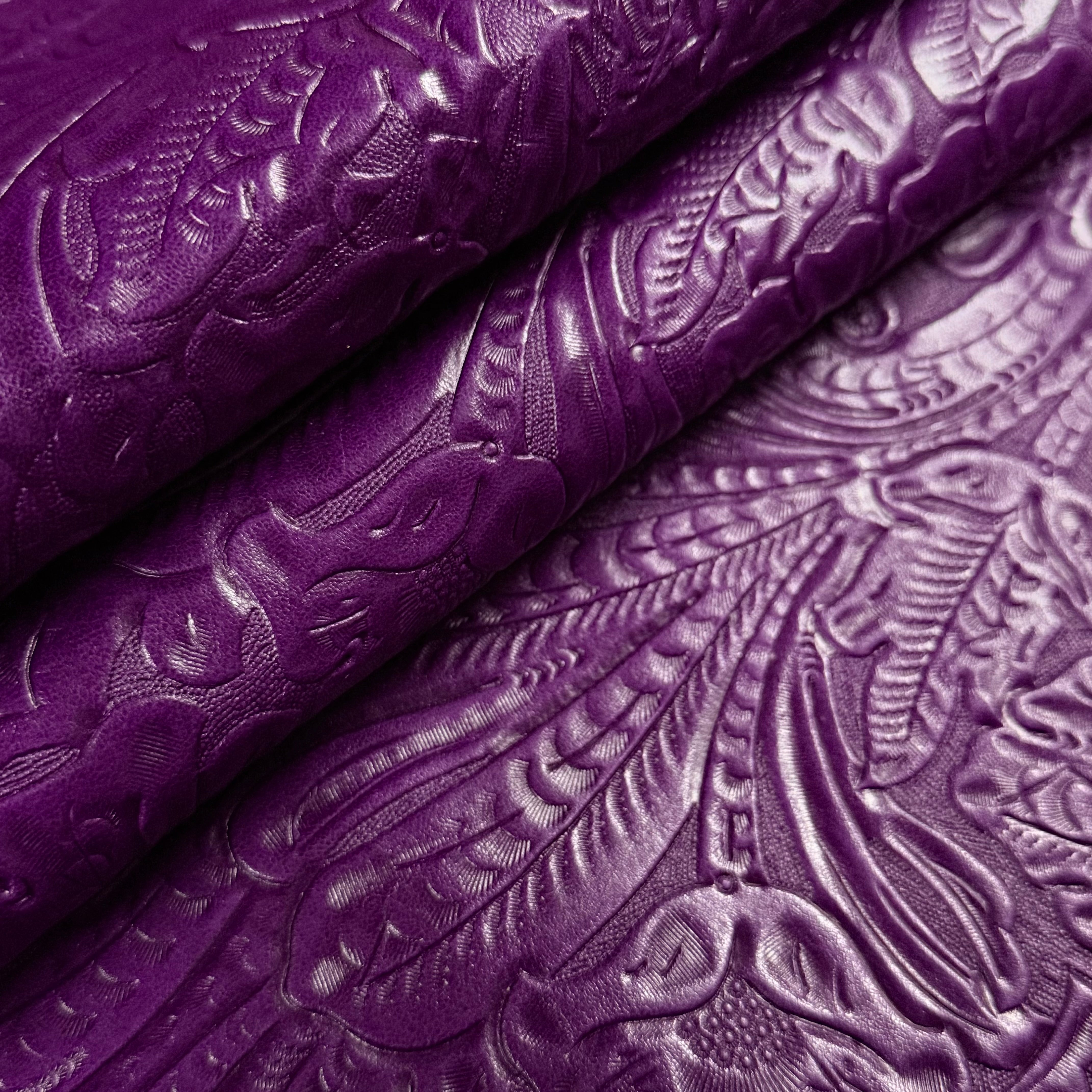Vibrant purple floral embossed oiled veg tan lamb leather, 2 oz, with a detailed Sheridan pattern.
