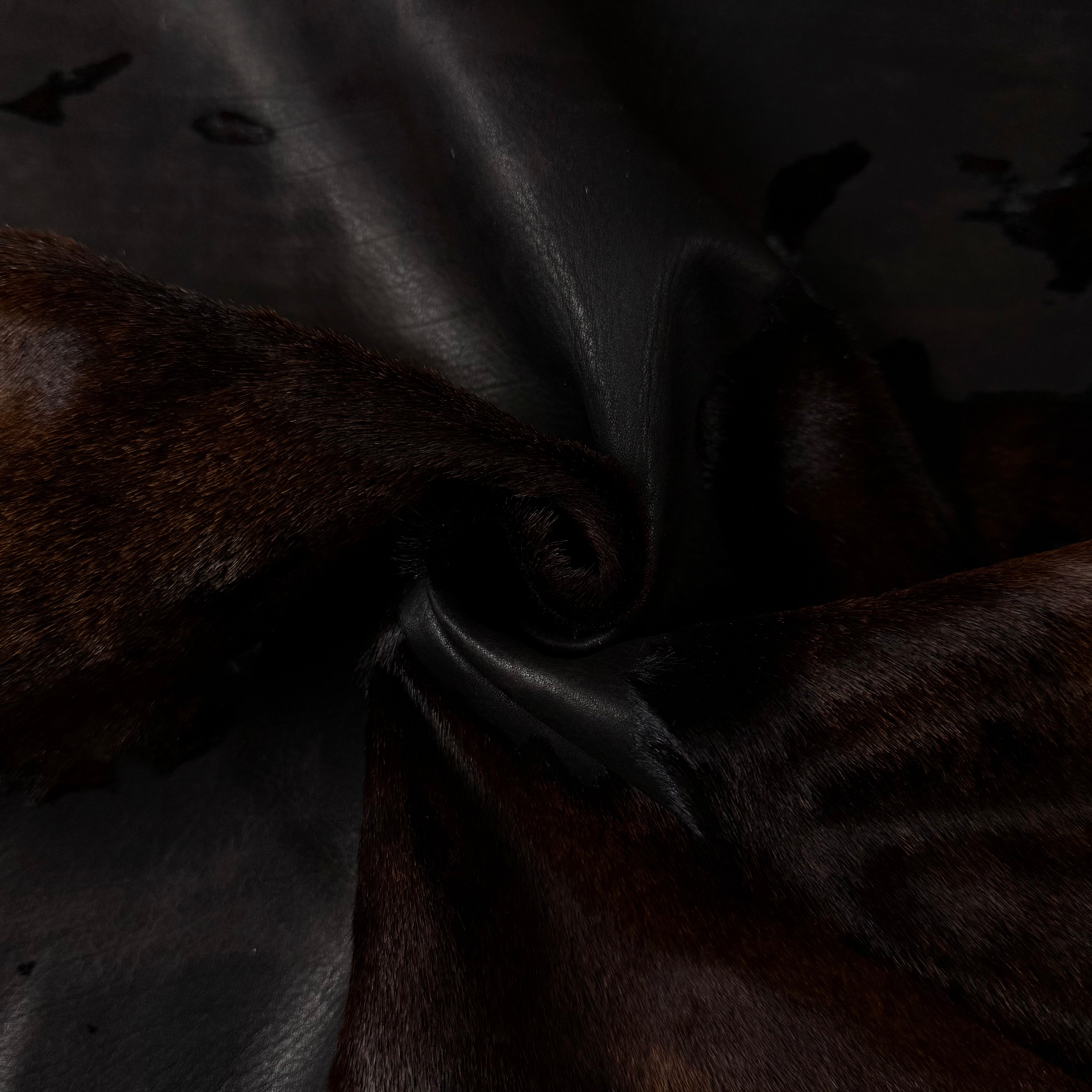 Acid Wash Cavallino Hair-On Calf leather, dark brown with black acid wash, soft texture.