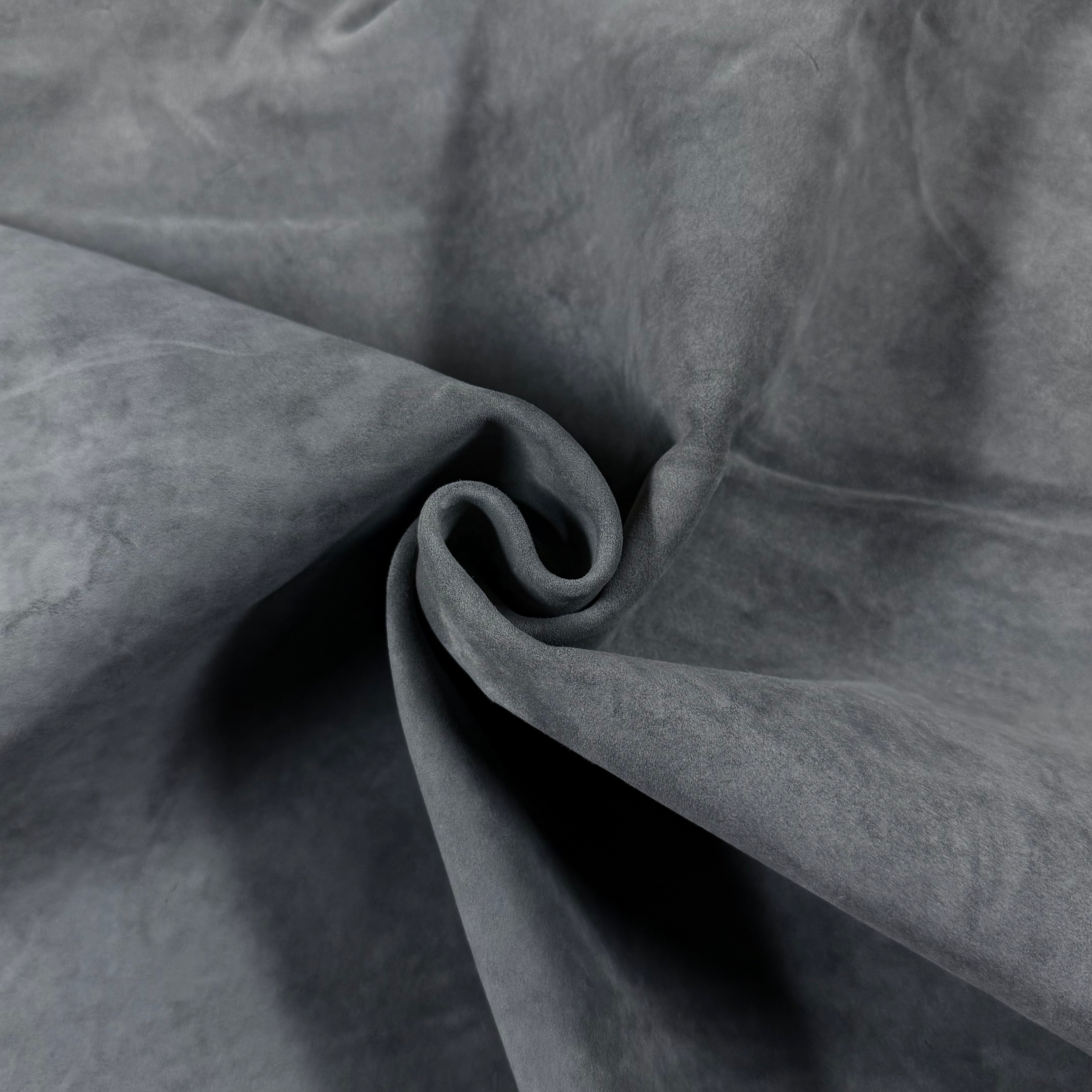 Close-up of a soft, gray Conceria Incas Italian Water Calf leather hide with a suede-like finish.