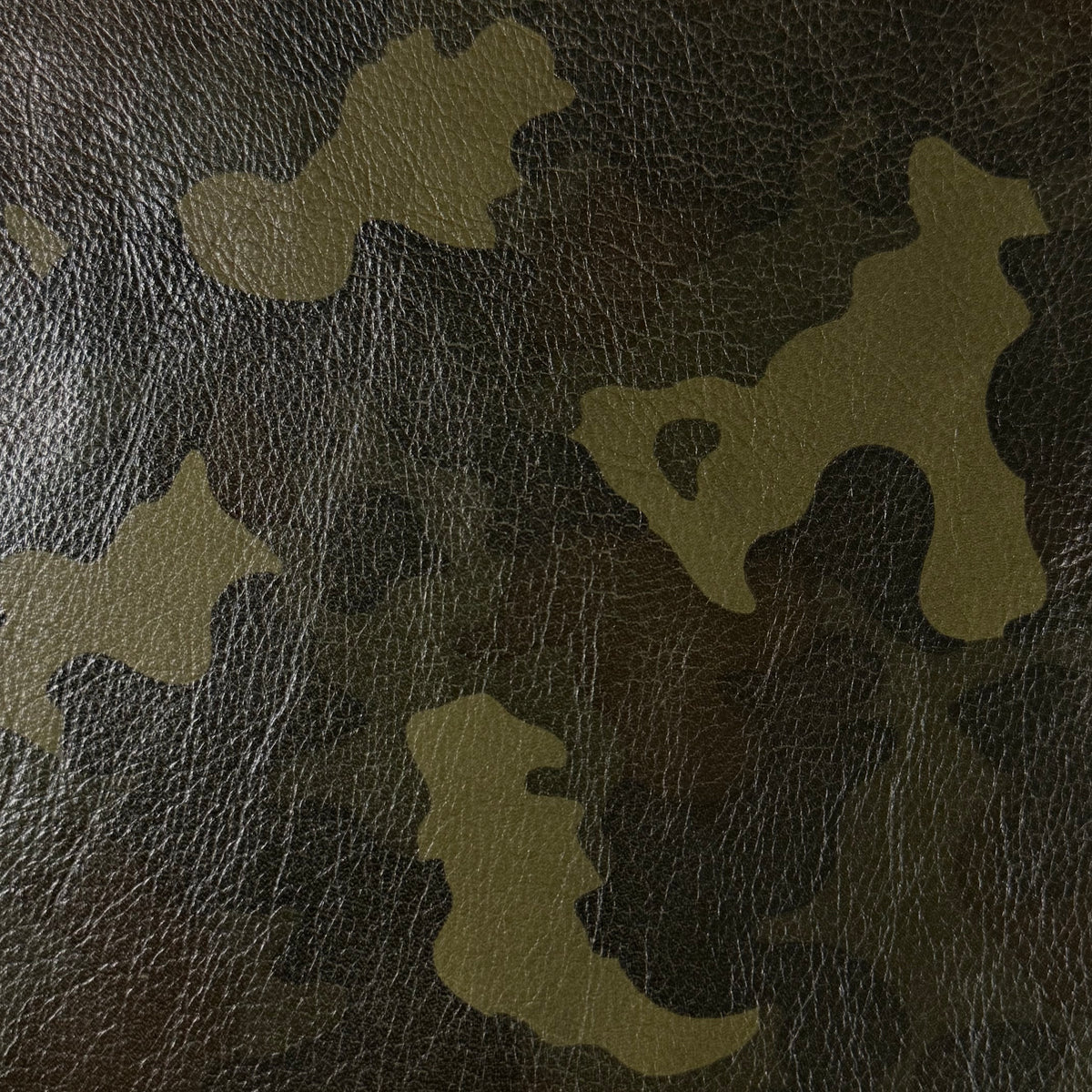 Camouflage Milled Floater Cow 3 oz leather in Woodland Camo with a textured, pebbled grain finish.