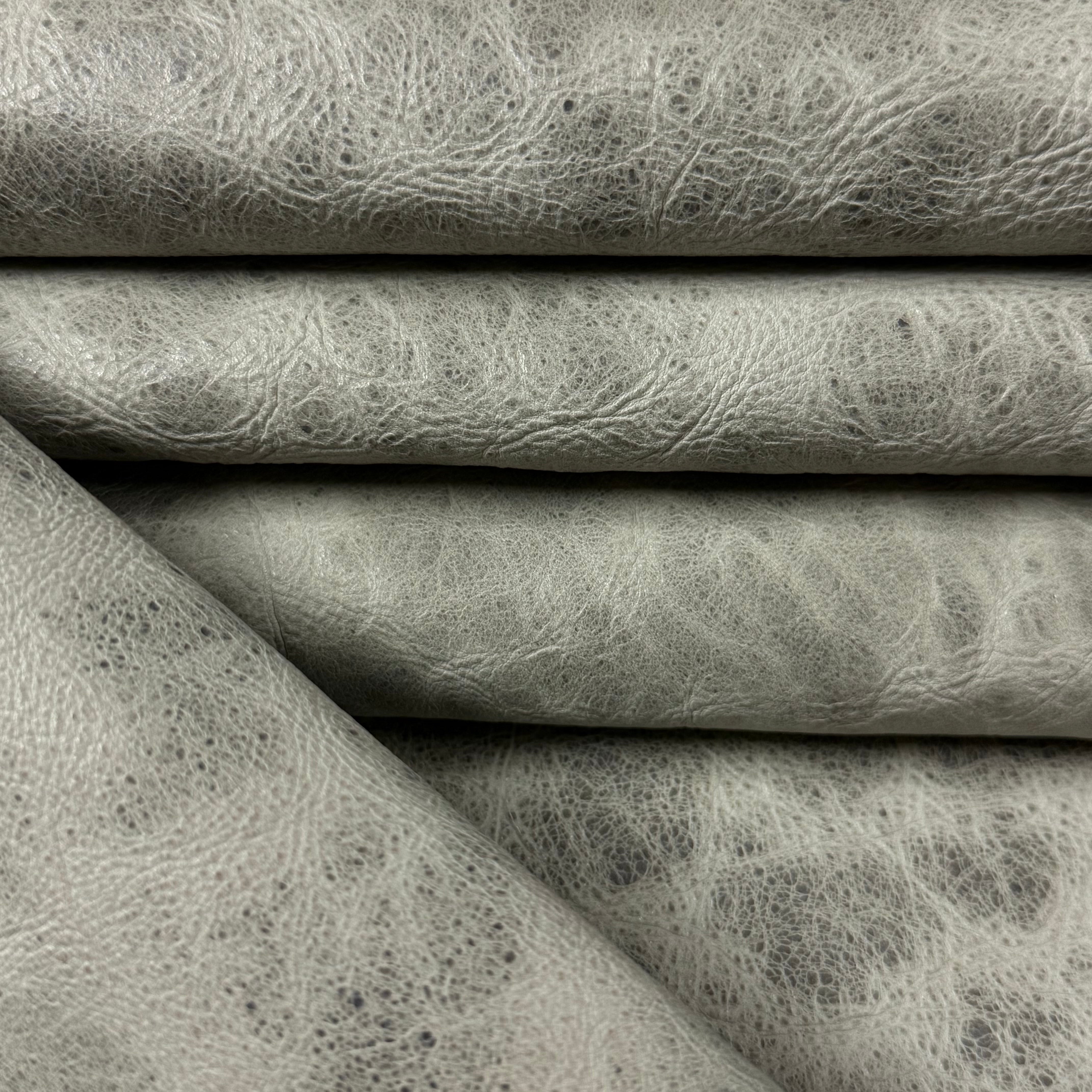 Grey Carnauba Waxed Pull-Up Cowhide leather, 2-3 oz, featuring a distressed, textured finish with natural grain.