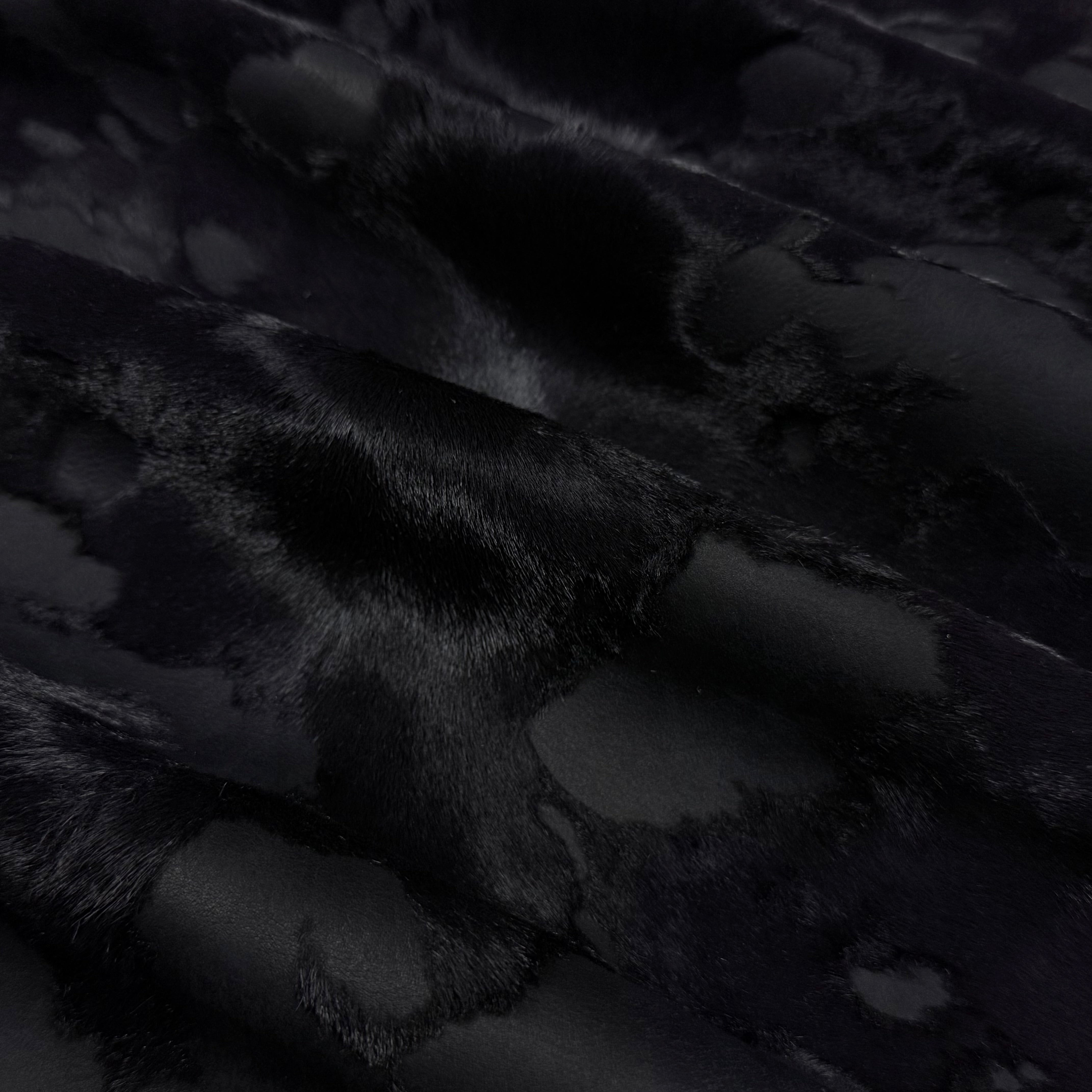 Black acid wash Cavallino hair-on calf leather with a two-tone burnout effect and short, sheared hair.