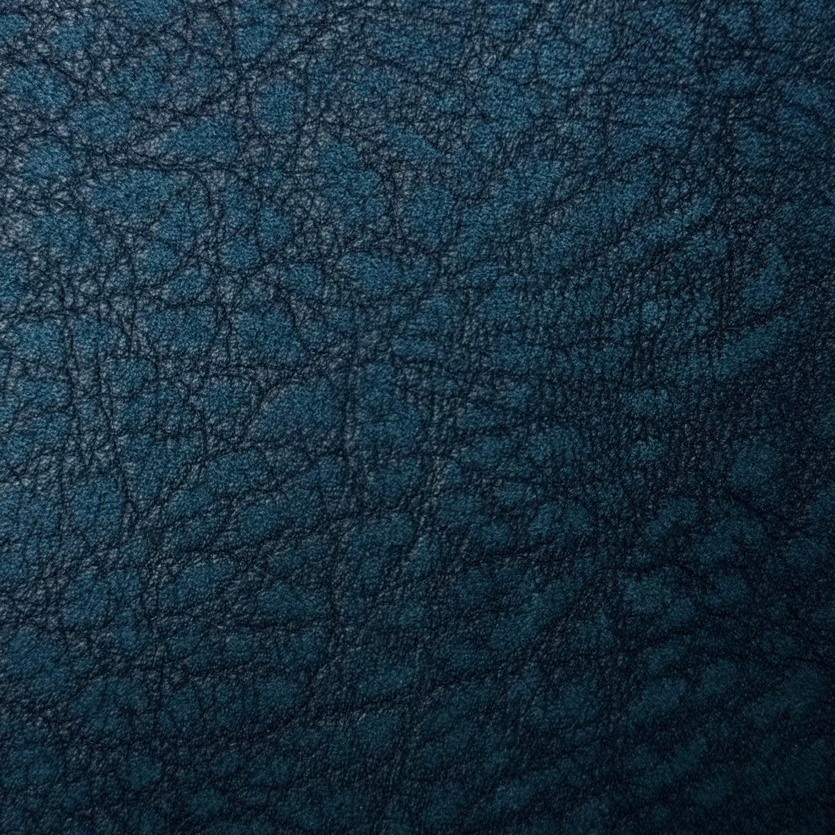 Teal distressed buffed elephant embossed cowhide leather, 3 oz, featuring a textured, rugged grain pattern.
