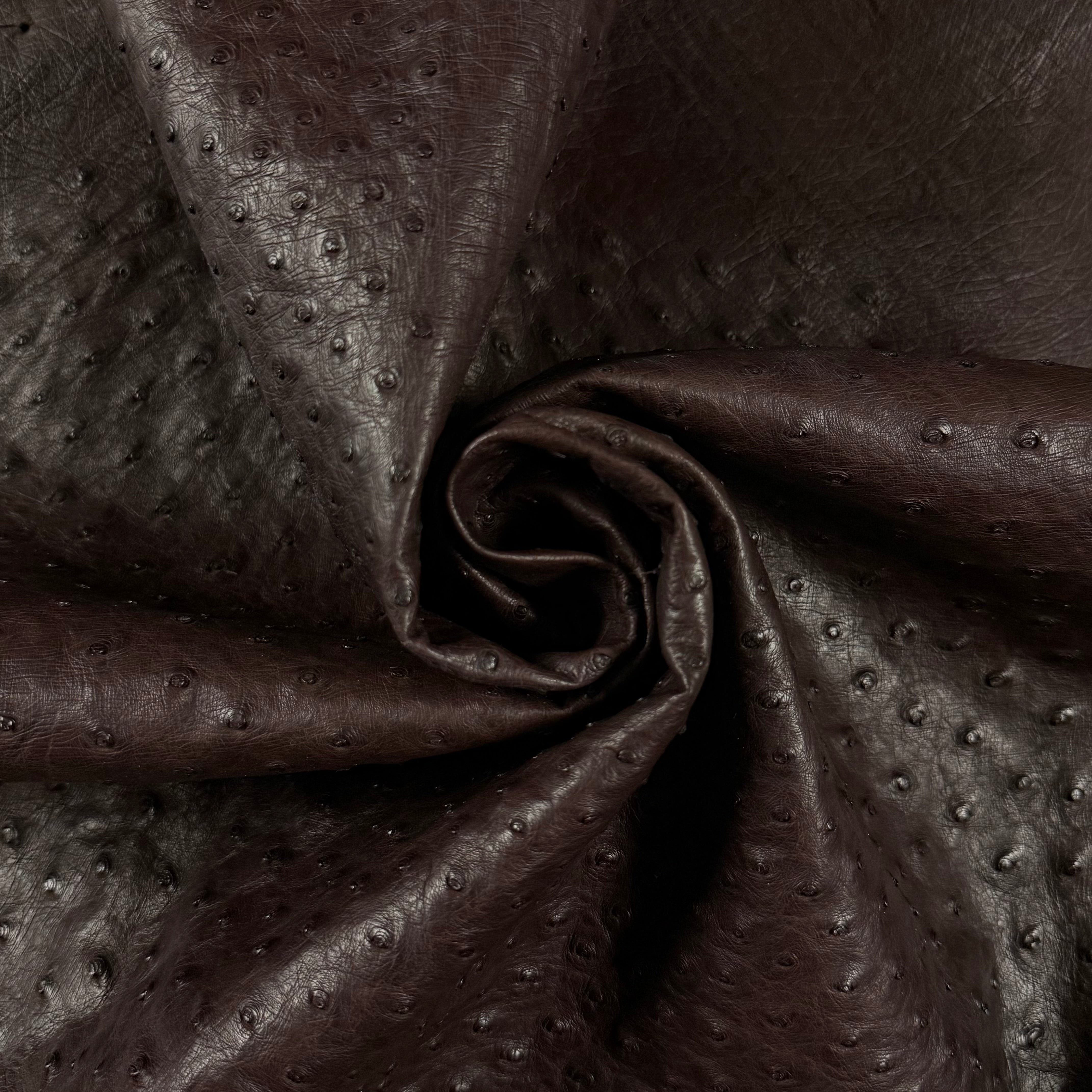 Dark brown full quill genuine ostrich leather, showcasing its iconic raised texture and soft temper.