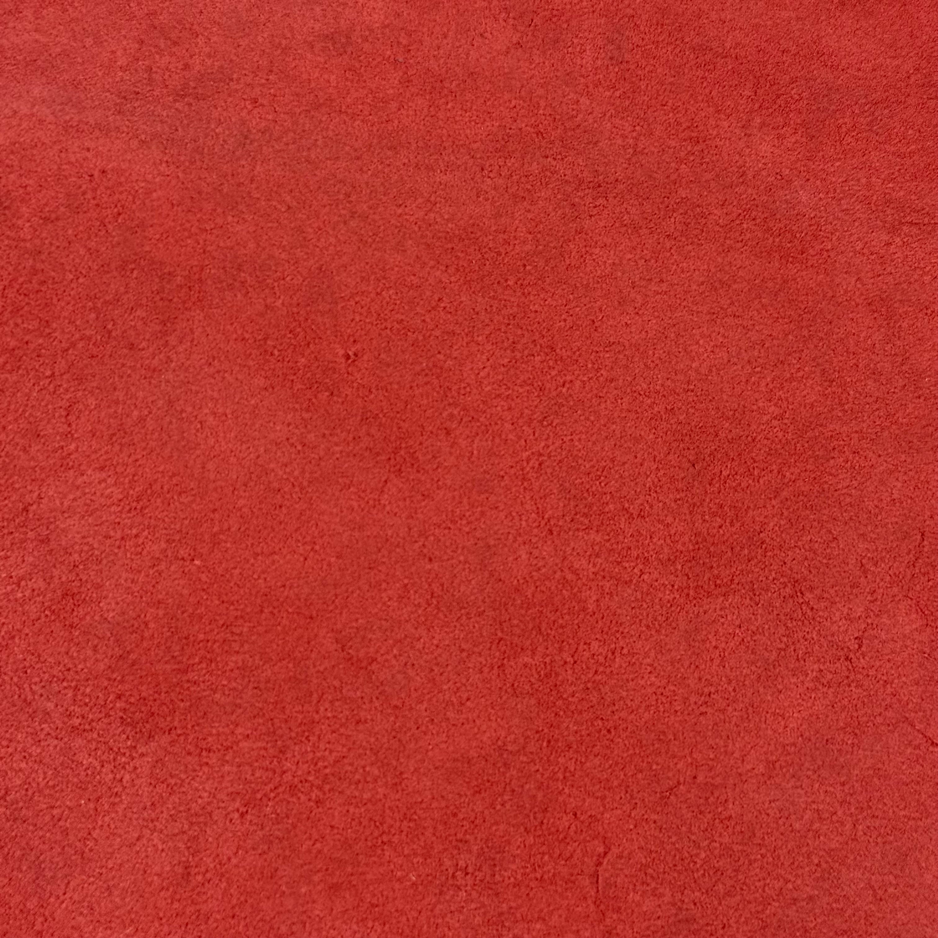 Close-up of vibrant red Conceria Incas Italian Water Calf leather with a soft, suede-like texture.