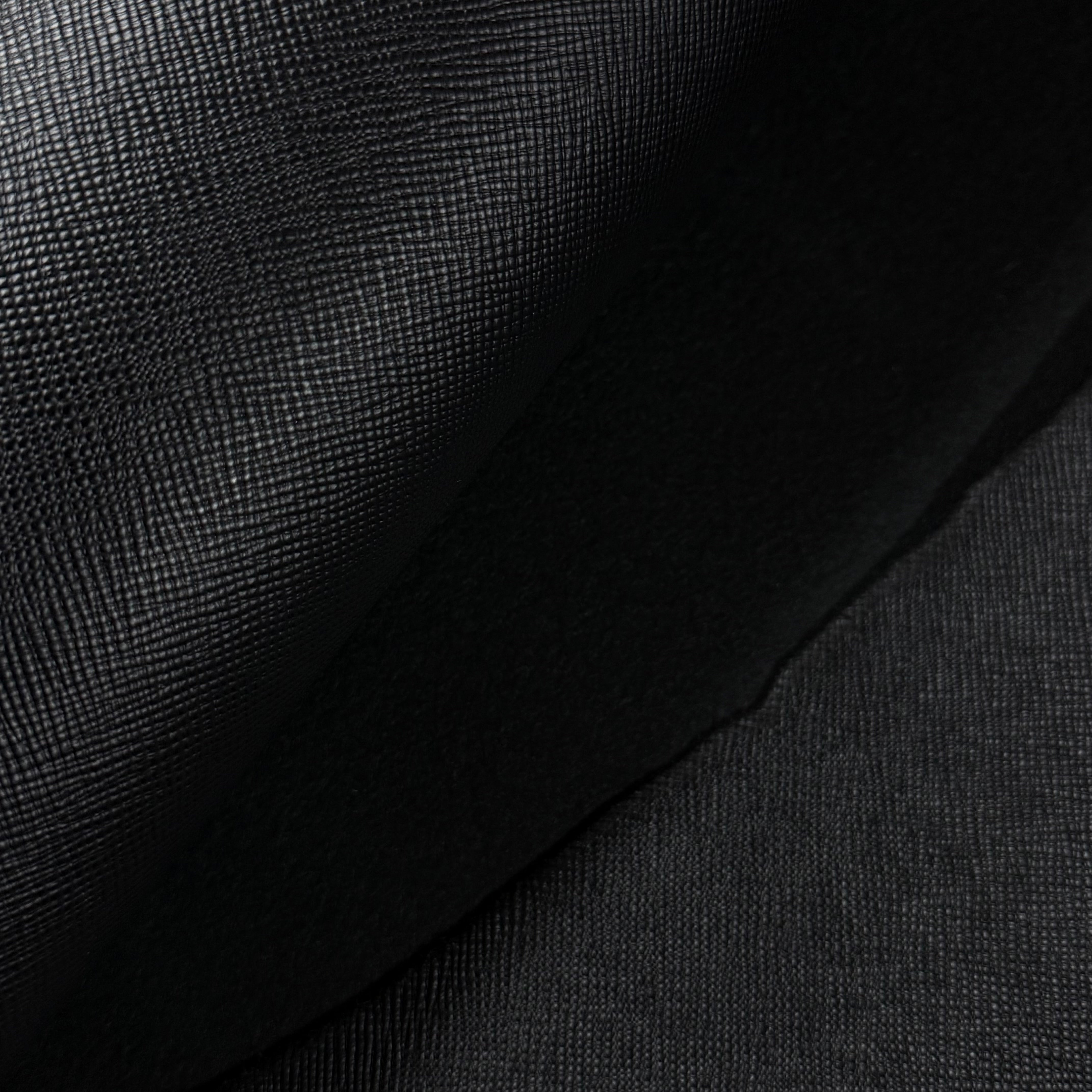 Black Conceria Walpier Hatch Buttero vegetable tanned leather with uniform hatch-embossed texture.
