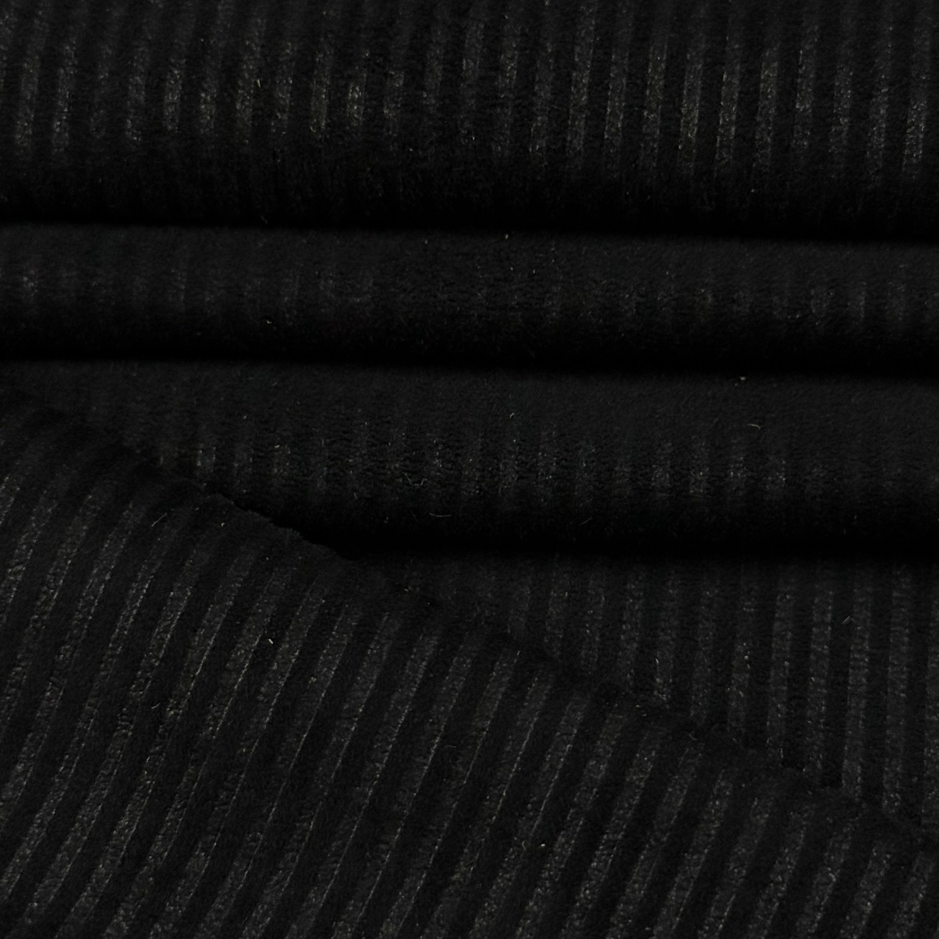 Black Corduroy Metis Lamb Suede fabric with ribbed texture, folded.
