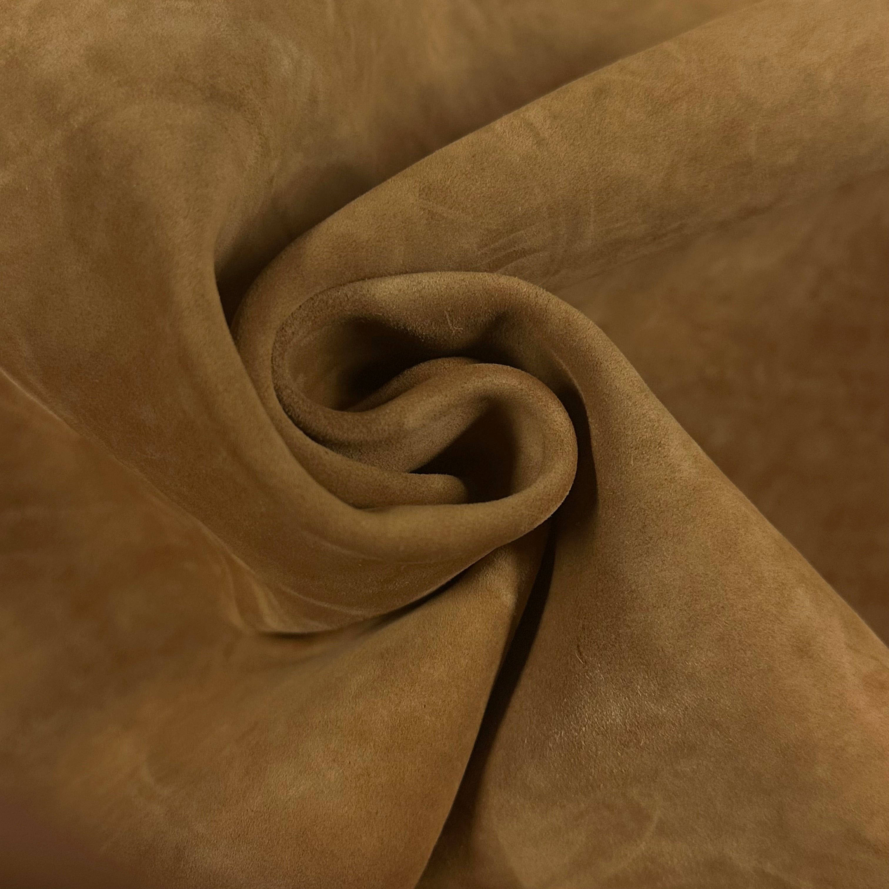 Close-up of soft, supple Conceria Incas Italian Water Calf leather in a warm tan color, showing its suede-like finish.