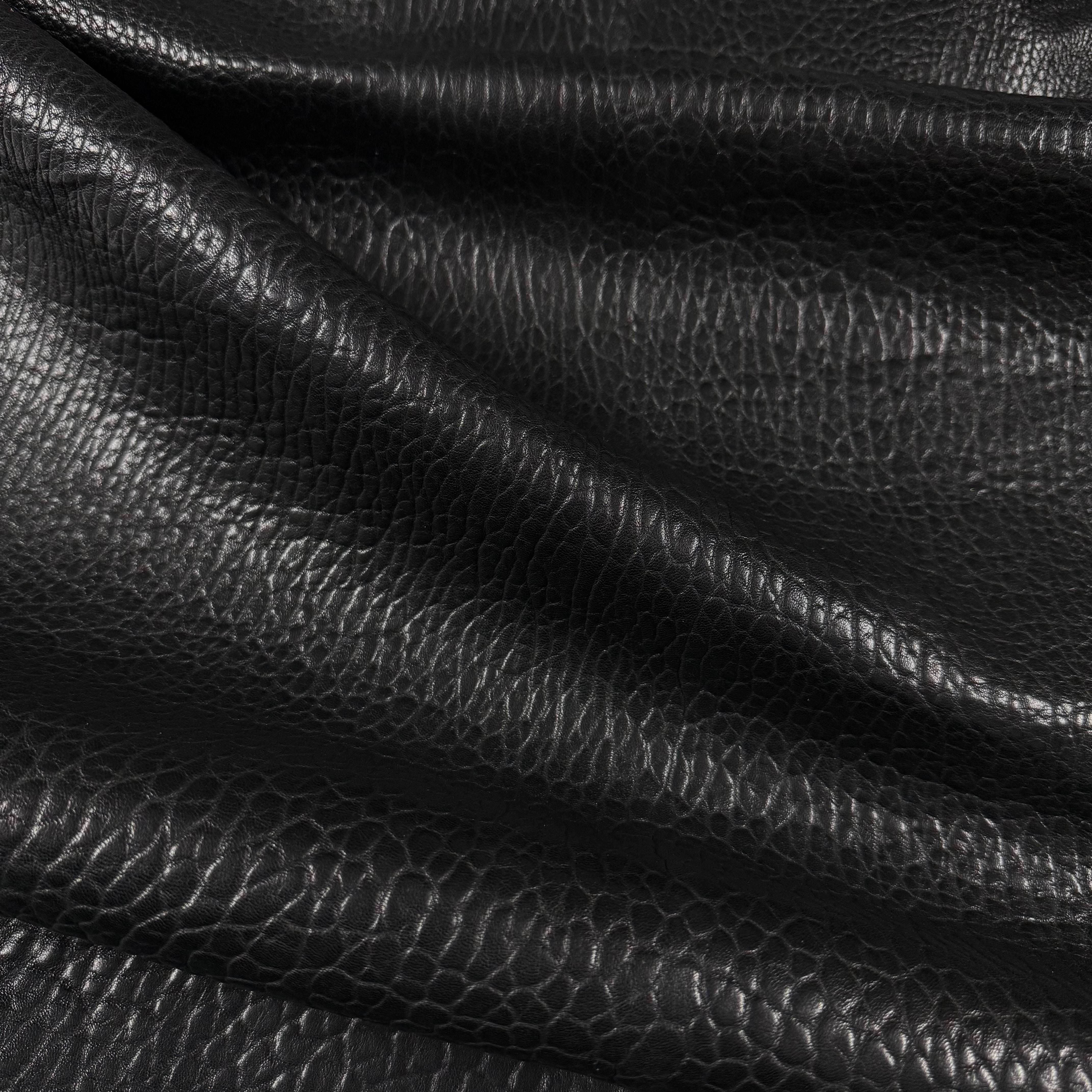 Black Shrunken Bubble Grain Veg Tan Lamb leather, 3-4 oz, with a natural, krispy texture.