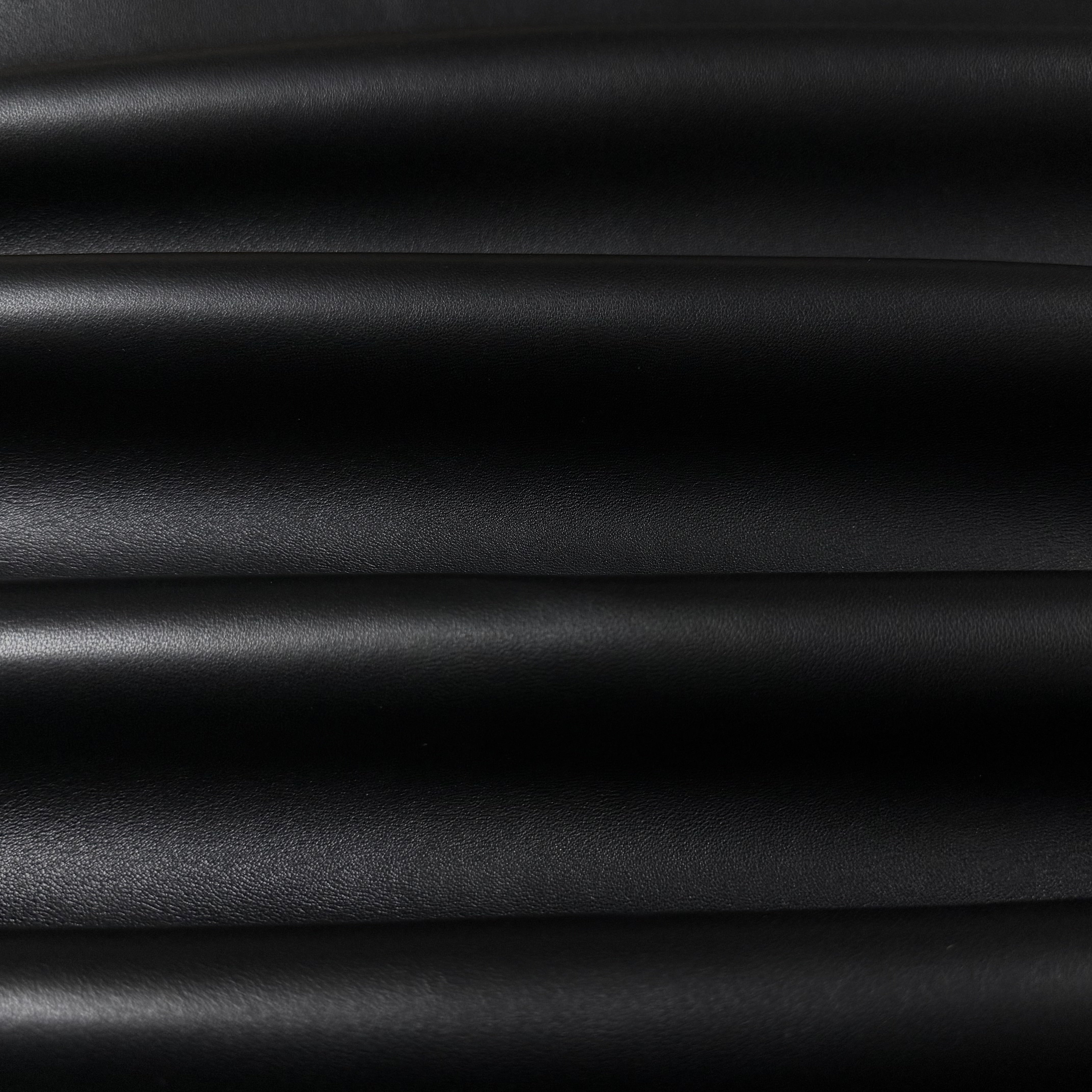 Luxury Aniline Lamb Nappa 2 oz leather in black, featuring a smooth, soft-touch texture with elegant natural folds.