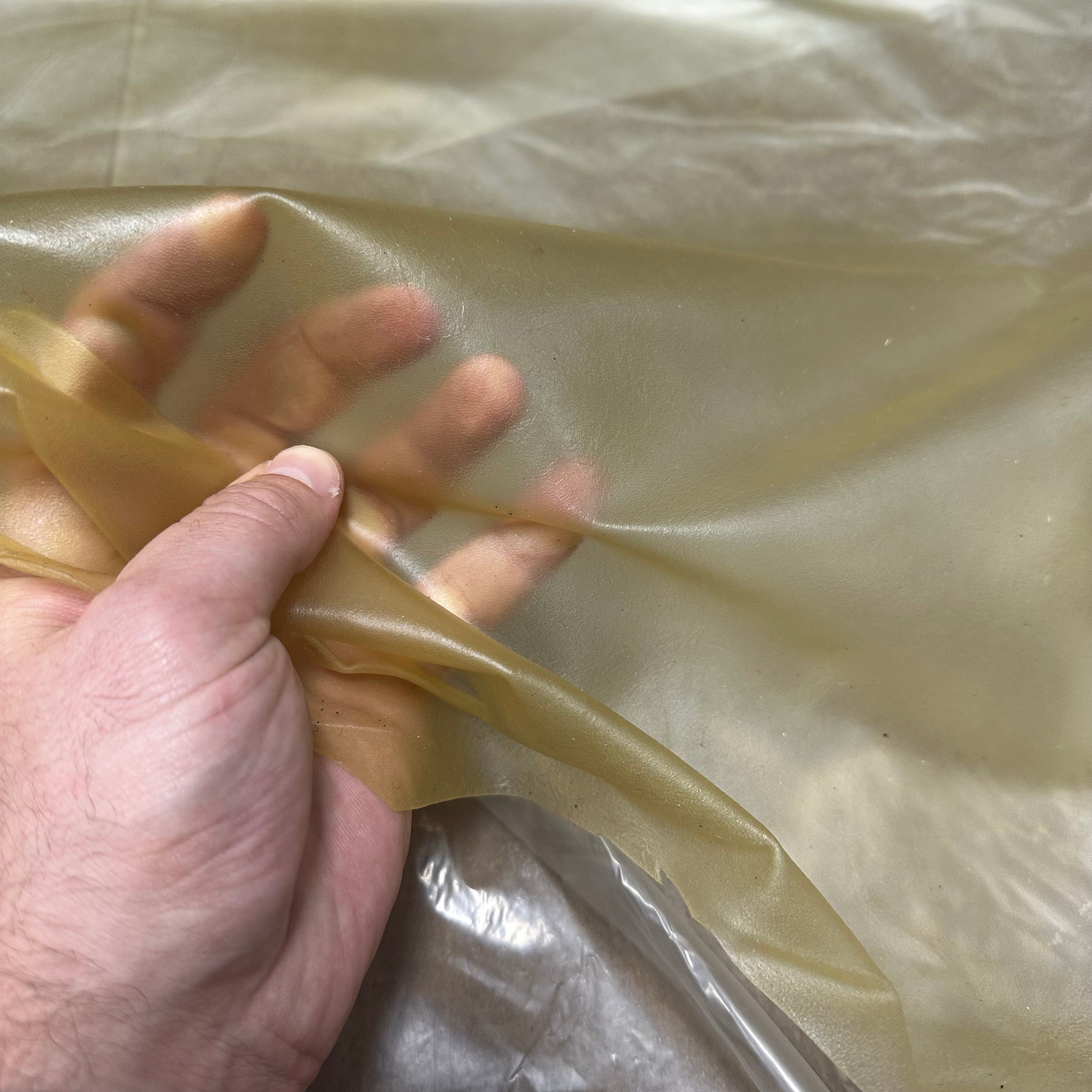 Transparent natural lamb leather, 1.5 oz, showing a thin, flexible, and translucent sheet held in a hand.
