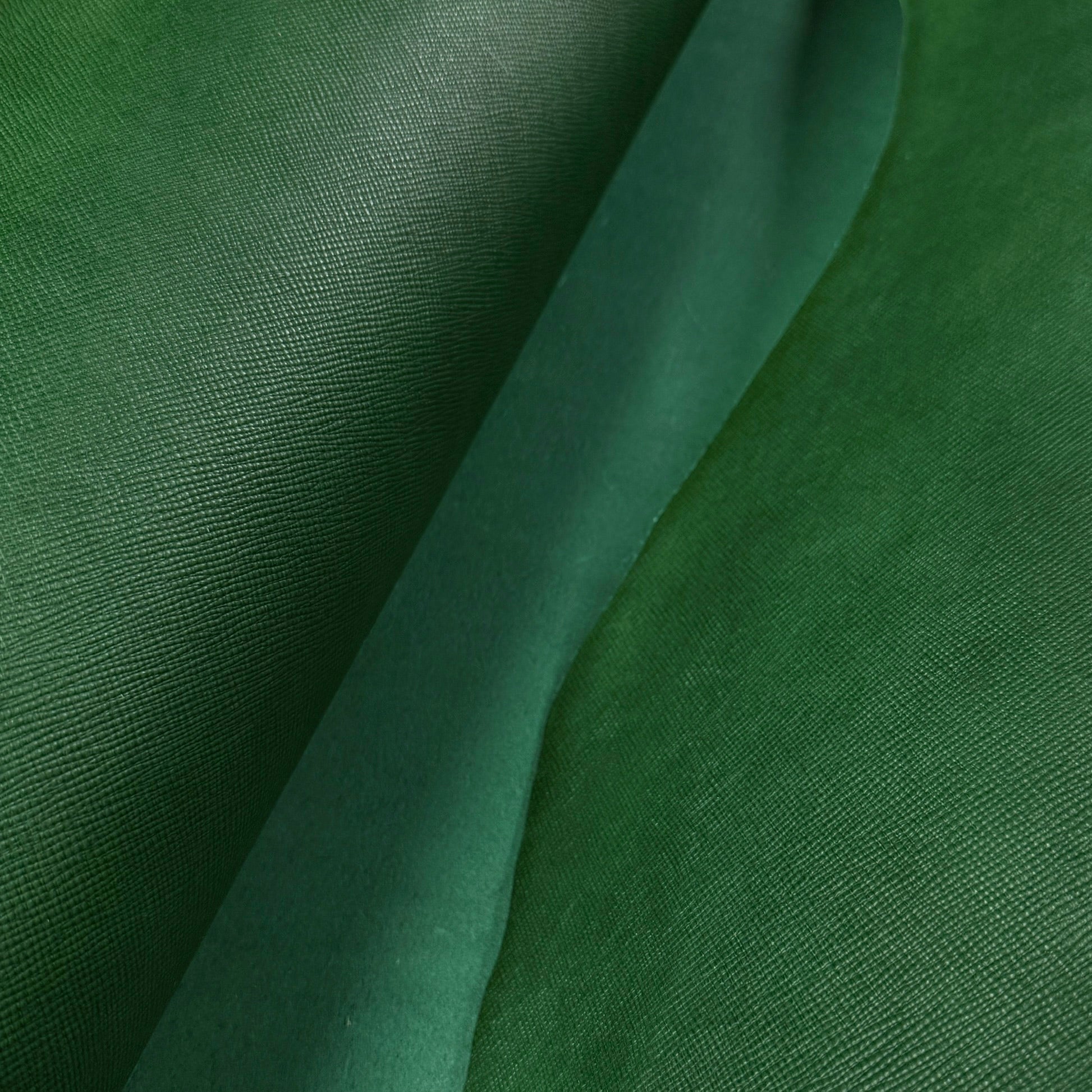 Green Conceria Walpier Hatch Buttero vegetable-tanned cow leather with a uniform embossed texture.
