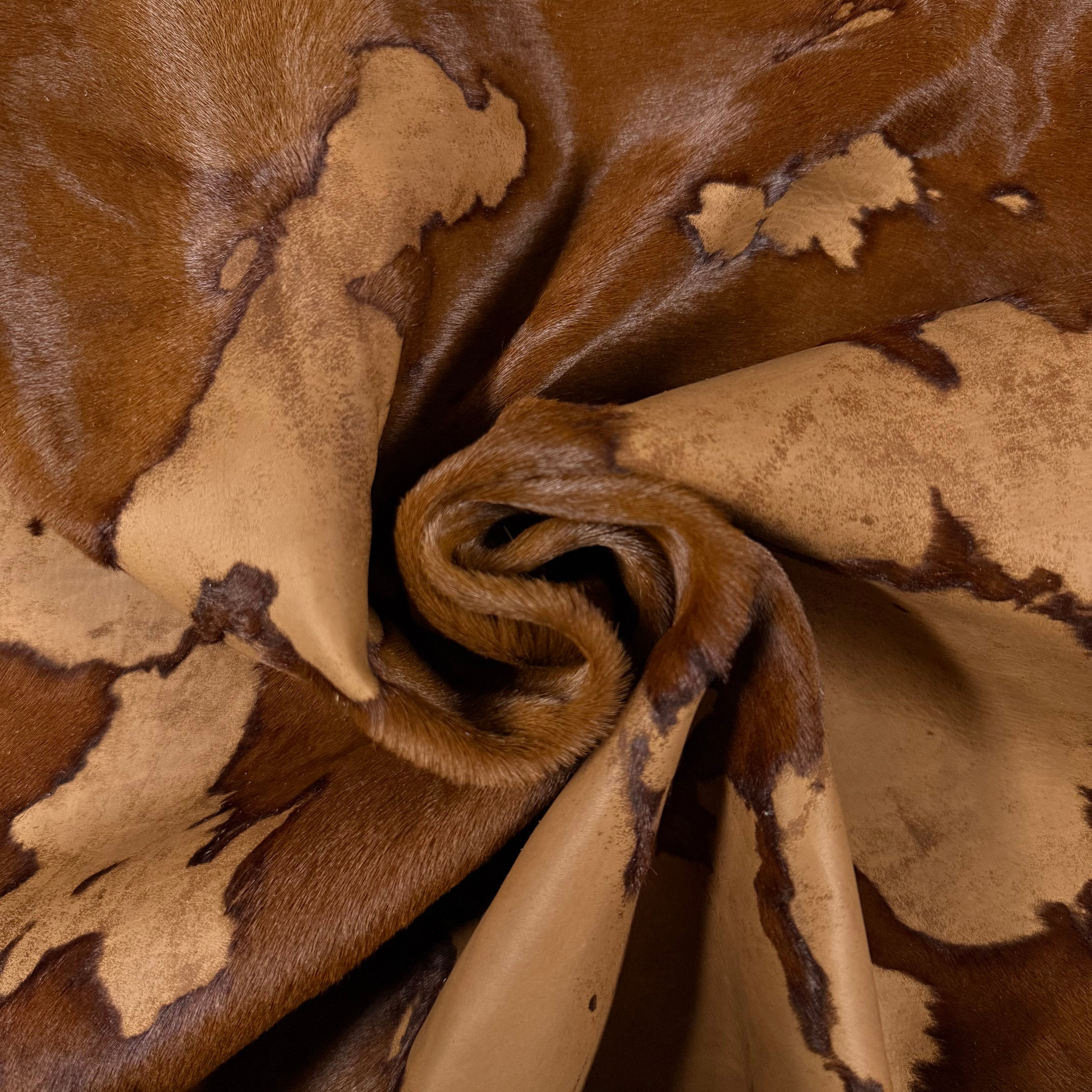 Acid Wash Cavallino Hair-On Calf leather, rust two-tone burnout effect, natural spotting, soft texture.