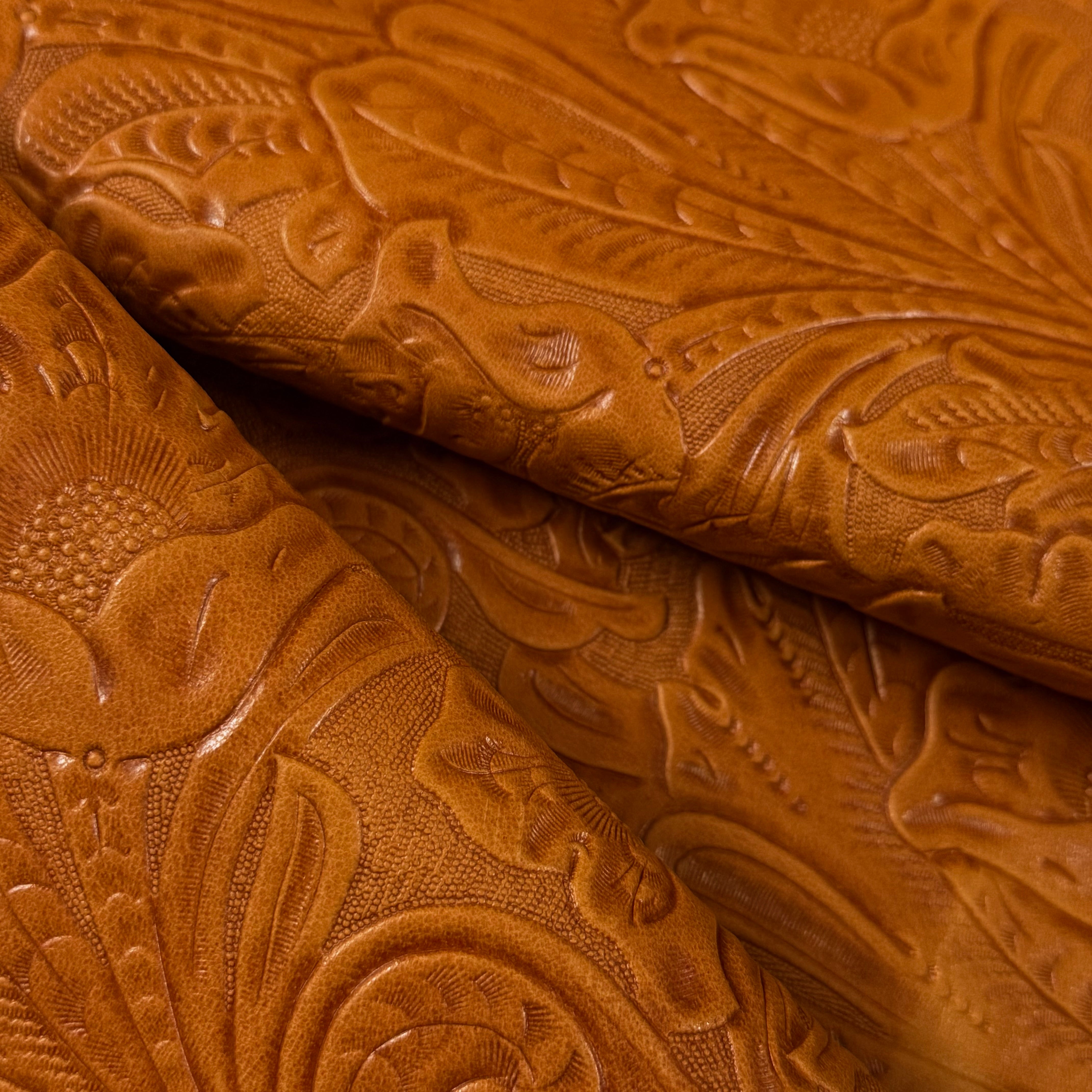 Brown floral embossed oiled veg tan lamb leather with a Sheridan pattern.