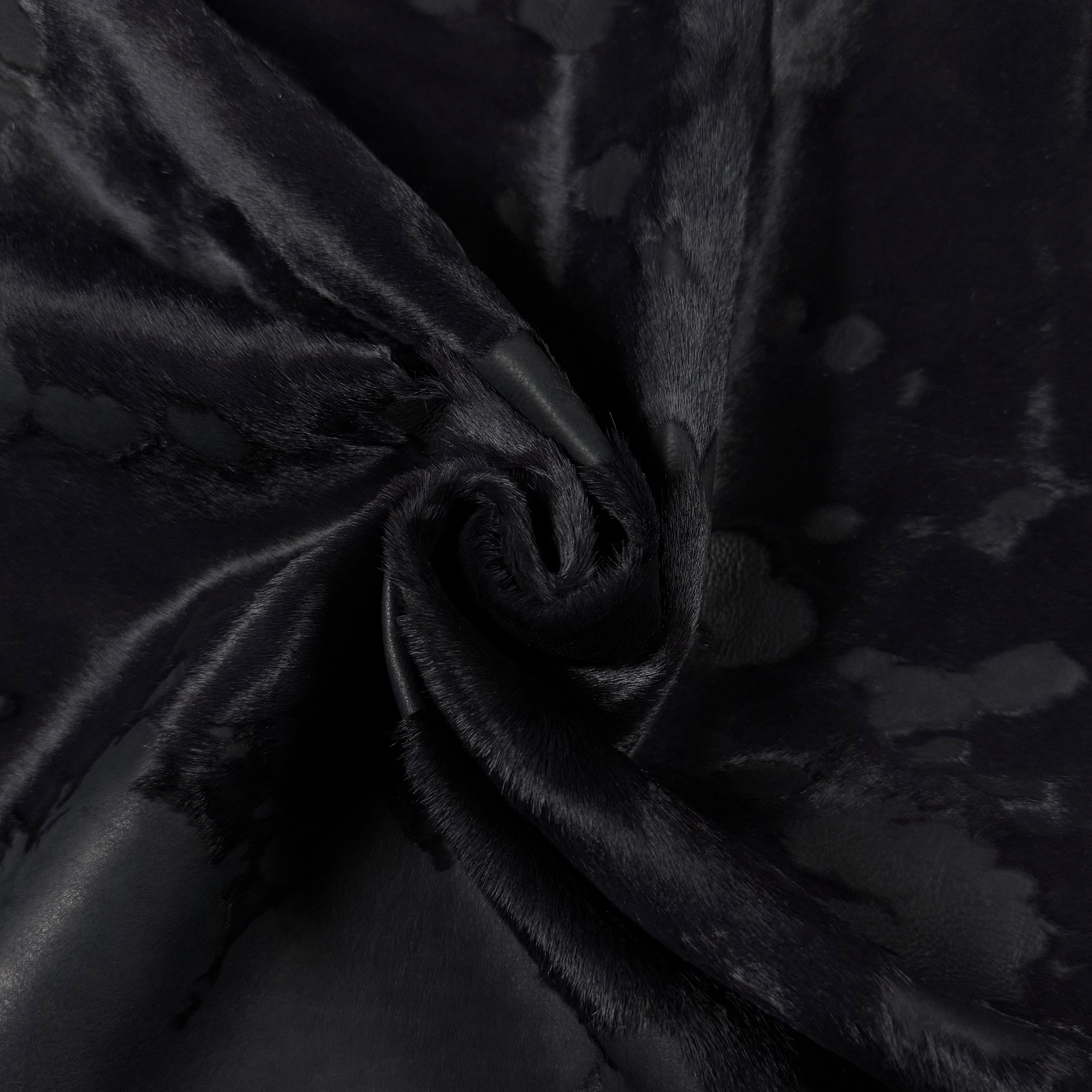 Black acid wash Cavallino hair-on calf leather with unique spotting and a soft temper.
