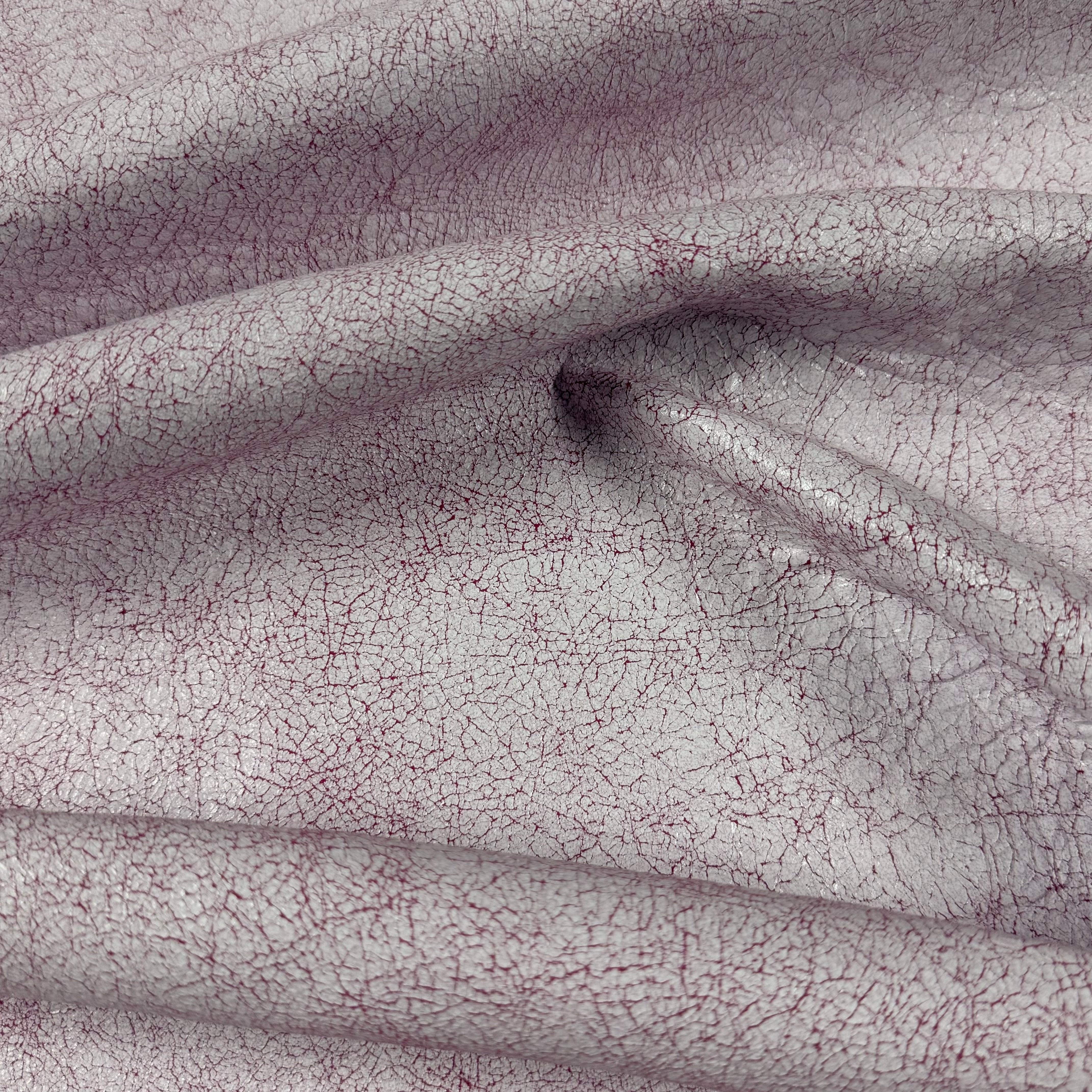 Crackle Leather in light purple with a textured, distressed finish and deep red veining in soft, draped folds.