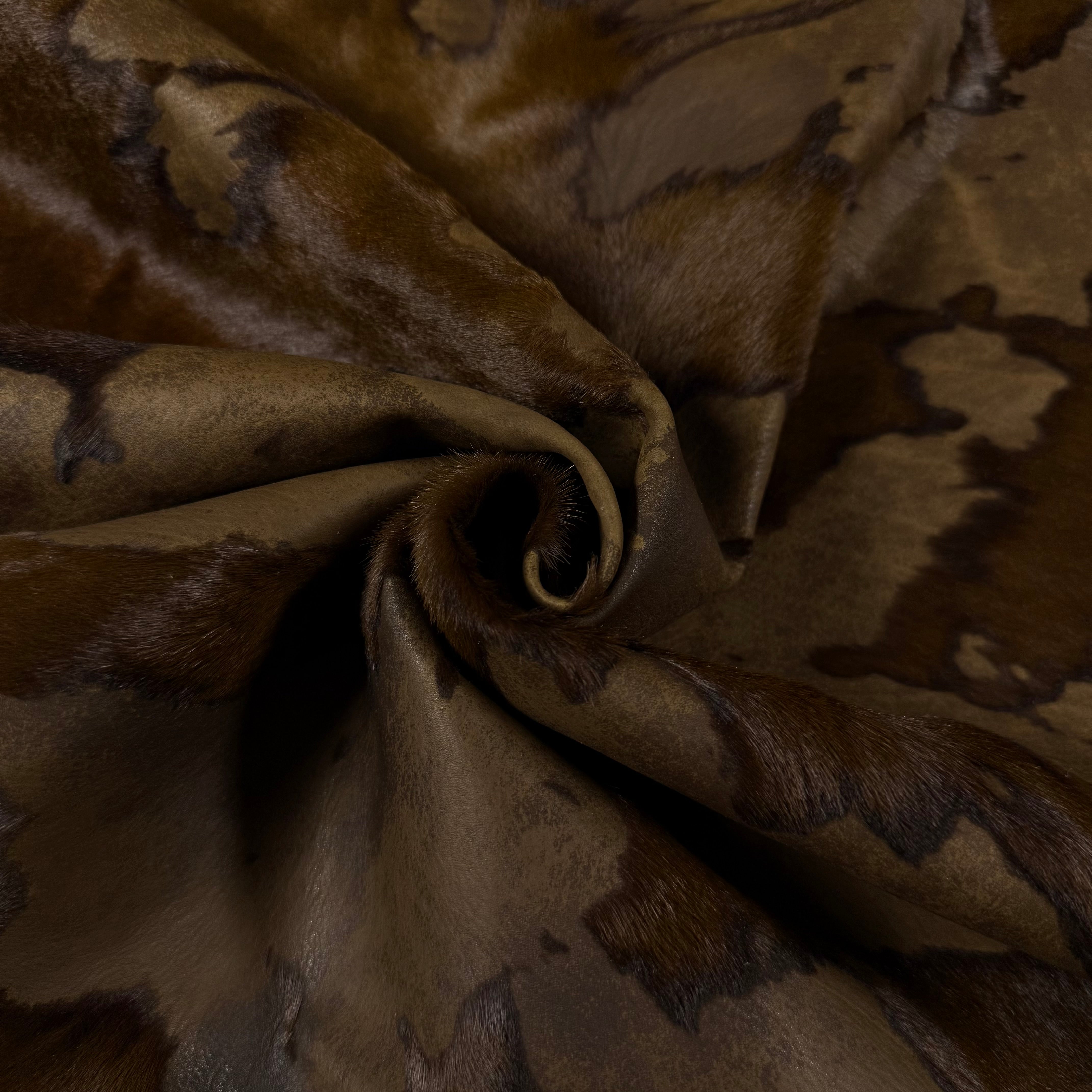 Brown acid wash Cavallino hair-on calf leather with unique dark spotting and a two-tone burnout effect.