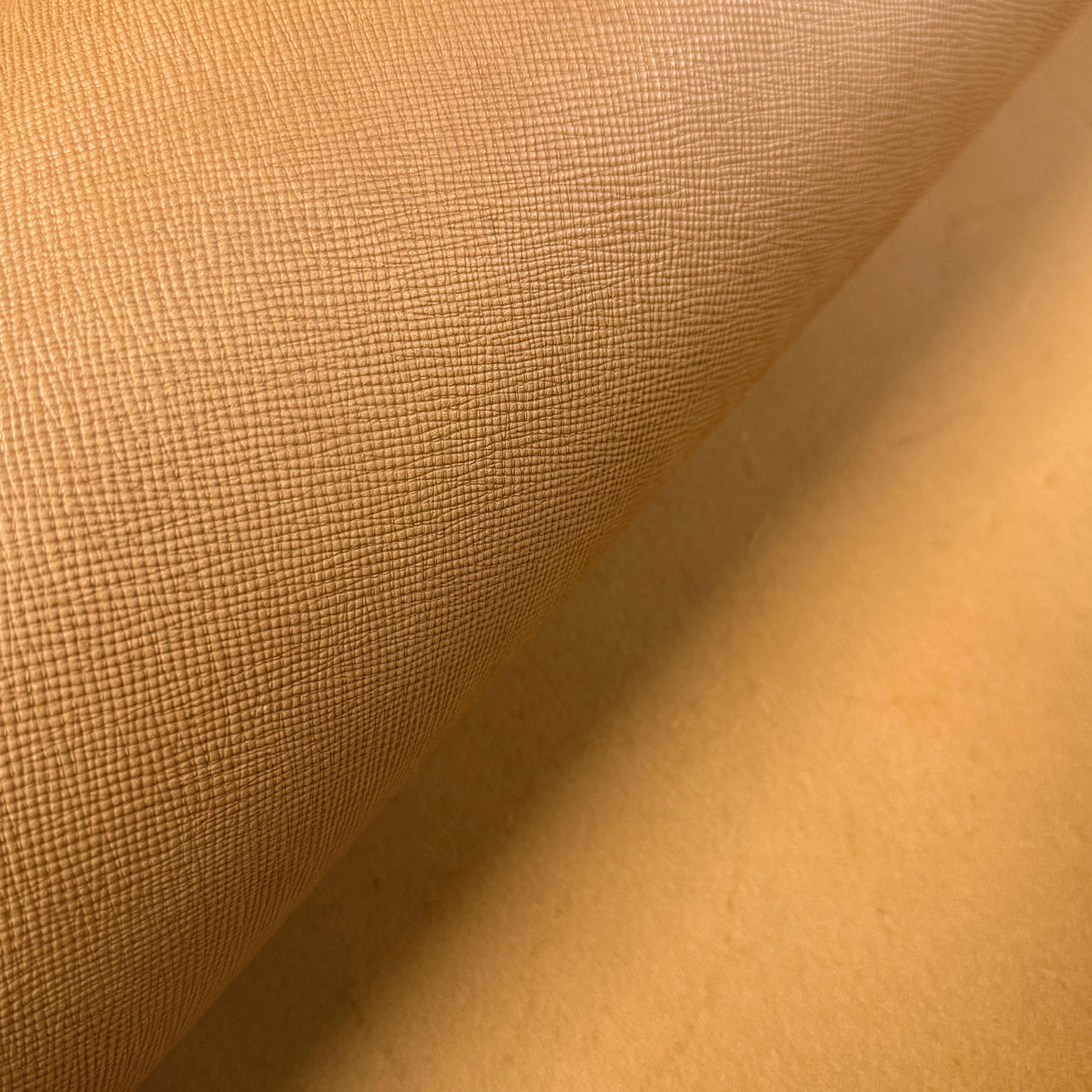 Cognac Conceria Walpier Hatch Buttero vegetable tanned cow leather, showing its uniform embossed texture.