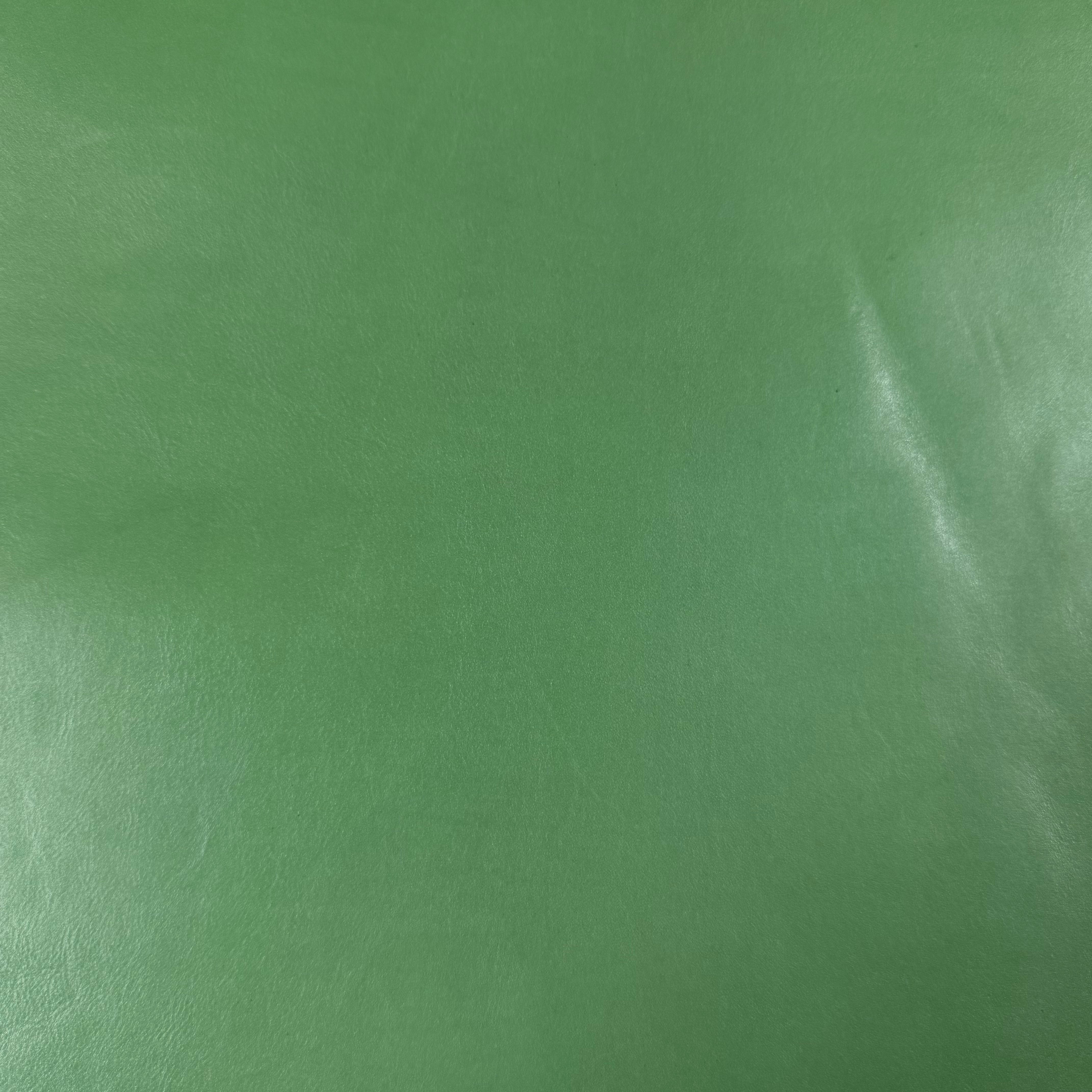 Smooth green vegetable-tanned baby calf leather with a polished aniline finish.