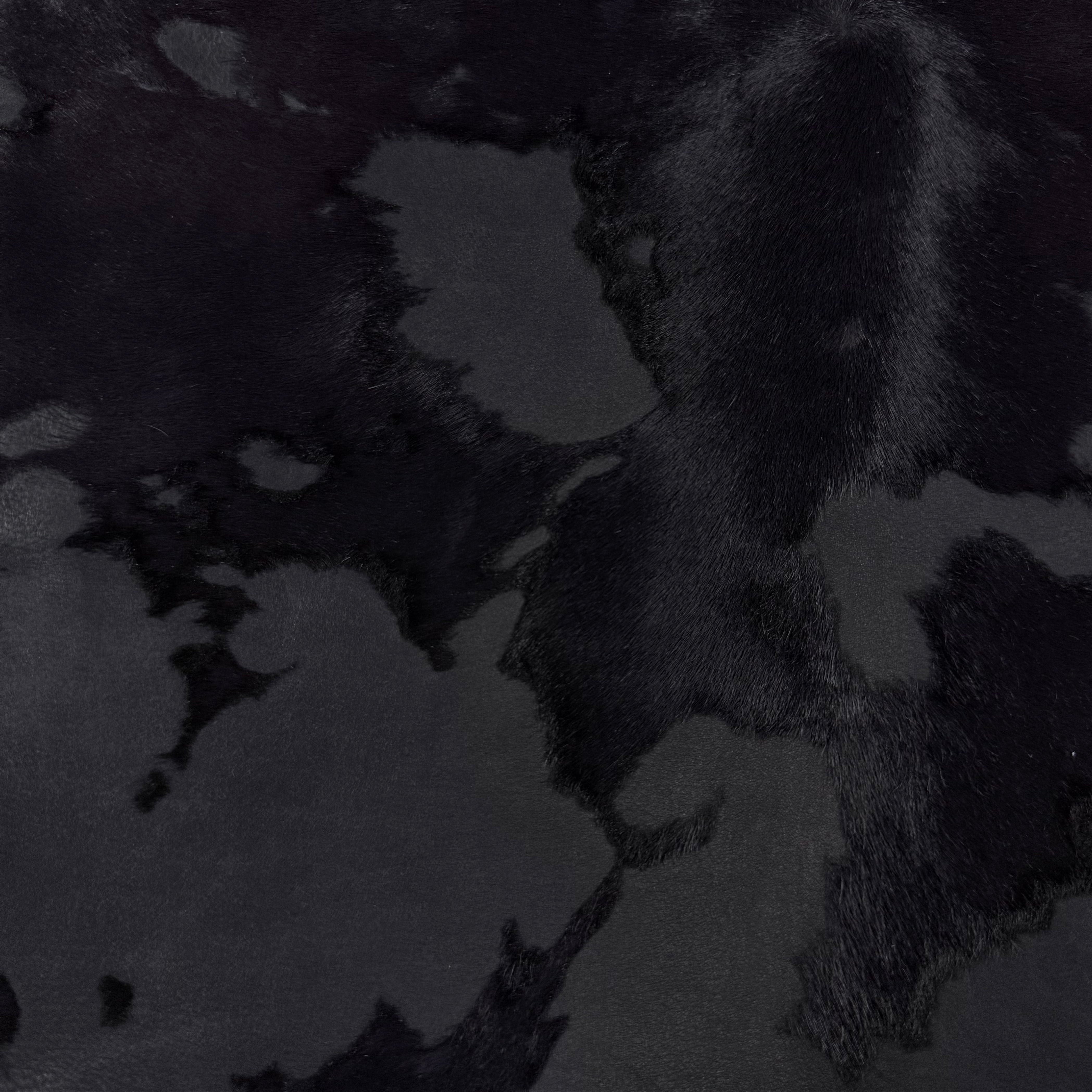 Black acid wash Cavallino hair-on calf leather with natural spotting and sheared hair texture.