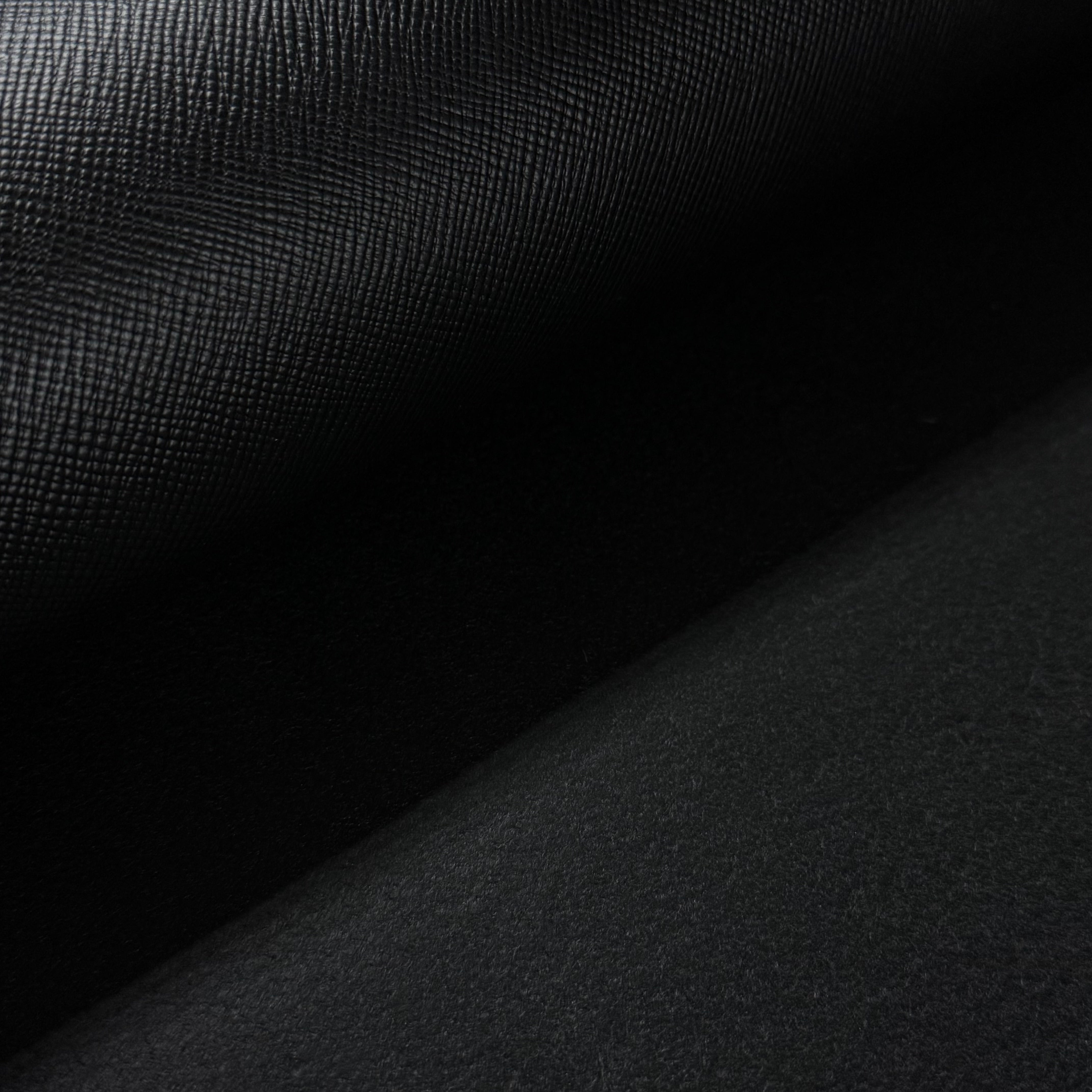 Black Conceria Walpier Hatch Buttero vegetable tanned leather, showing the textured front and smooth back.