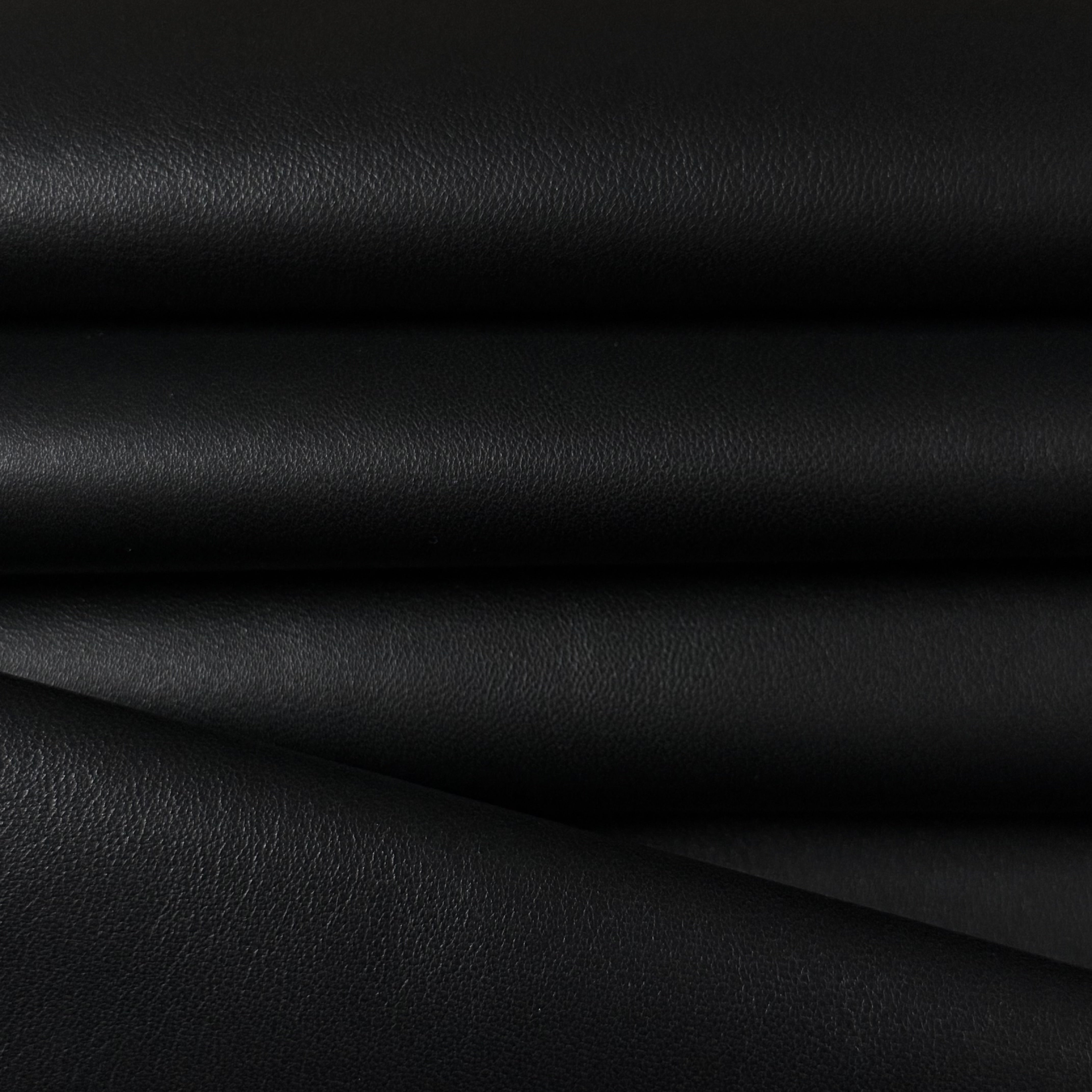 Black Luxury Aniline Lamb Nappa leather, smooth and drapey with a subtle sheen.