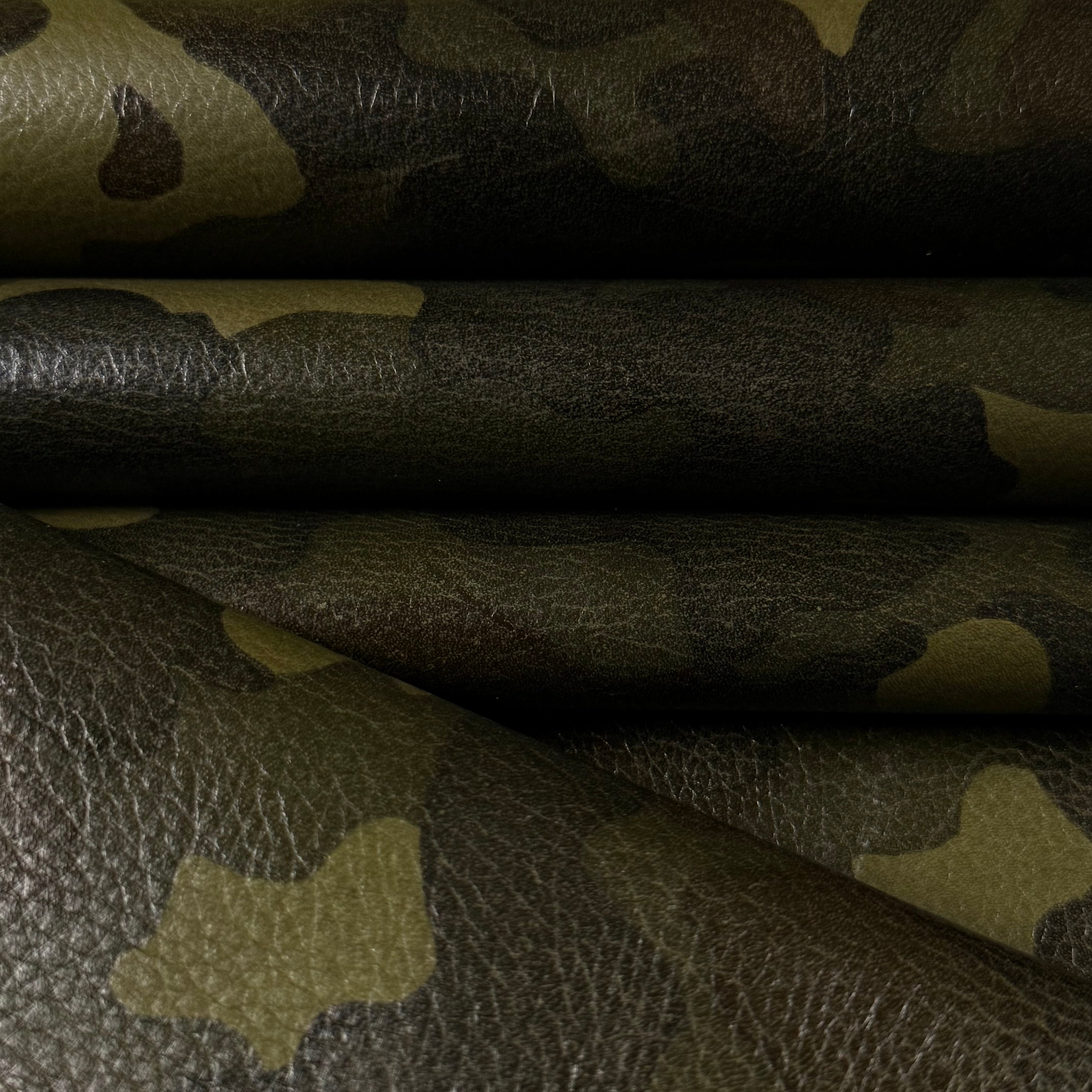 Camouflage Milled Floater Cow 3 oz leather in Woodland Camo with a textured, pebbled finish and green camo pattern.