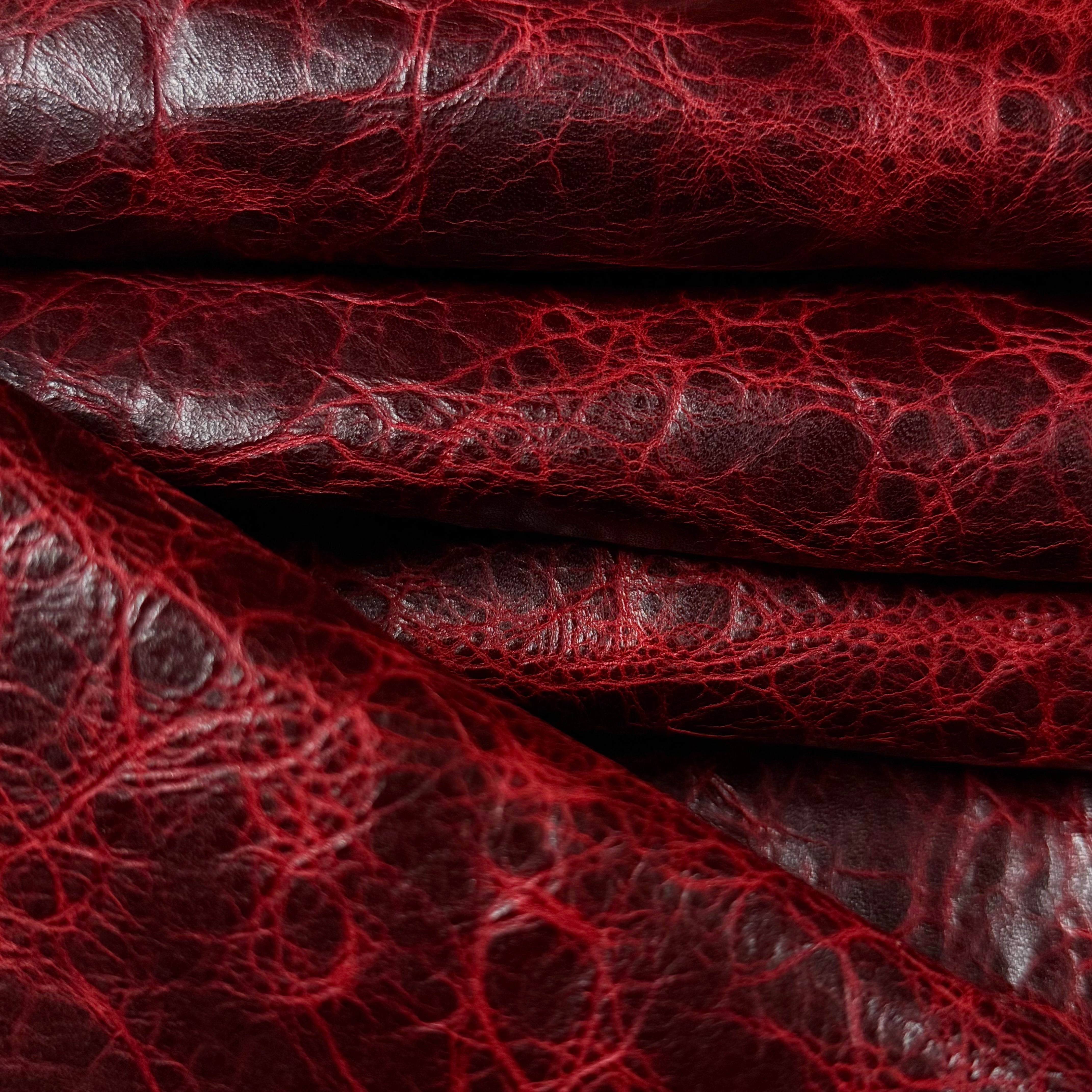 Deep red Carnauba waxed pull-up cowhide leather, 2-3 oz weight with a rich, distressed crackled texture.