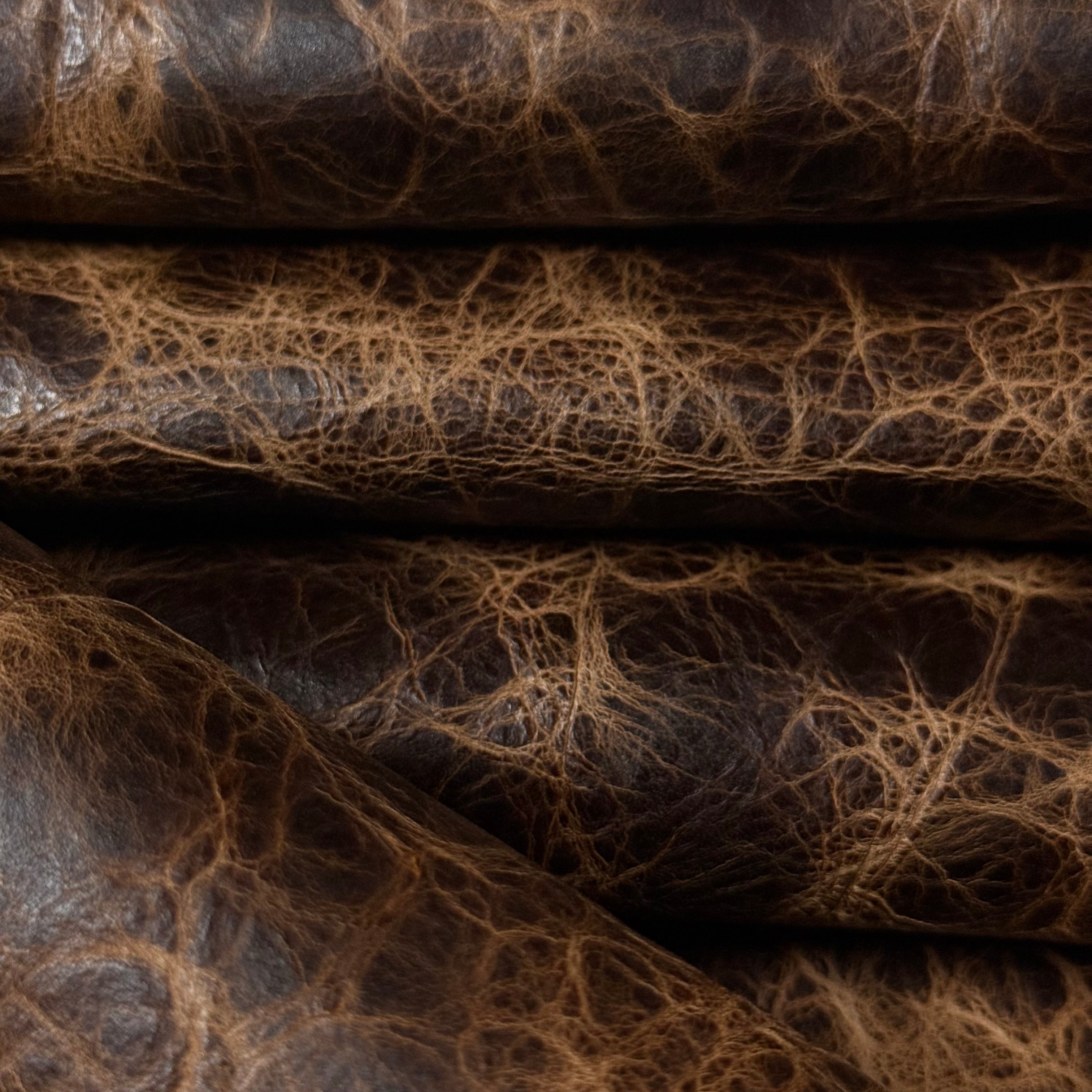 Dark brown Carnauba Waxed Pull-Up Cowhide, 2-3 oz leather with a distressed, textured finish and natural grain.