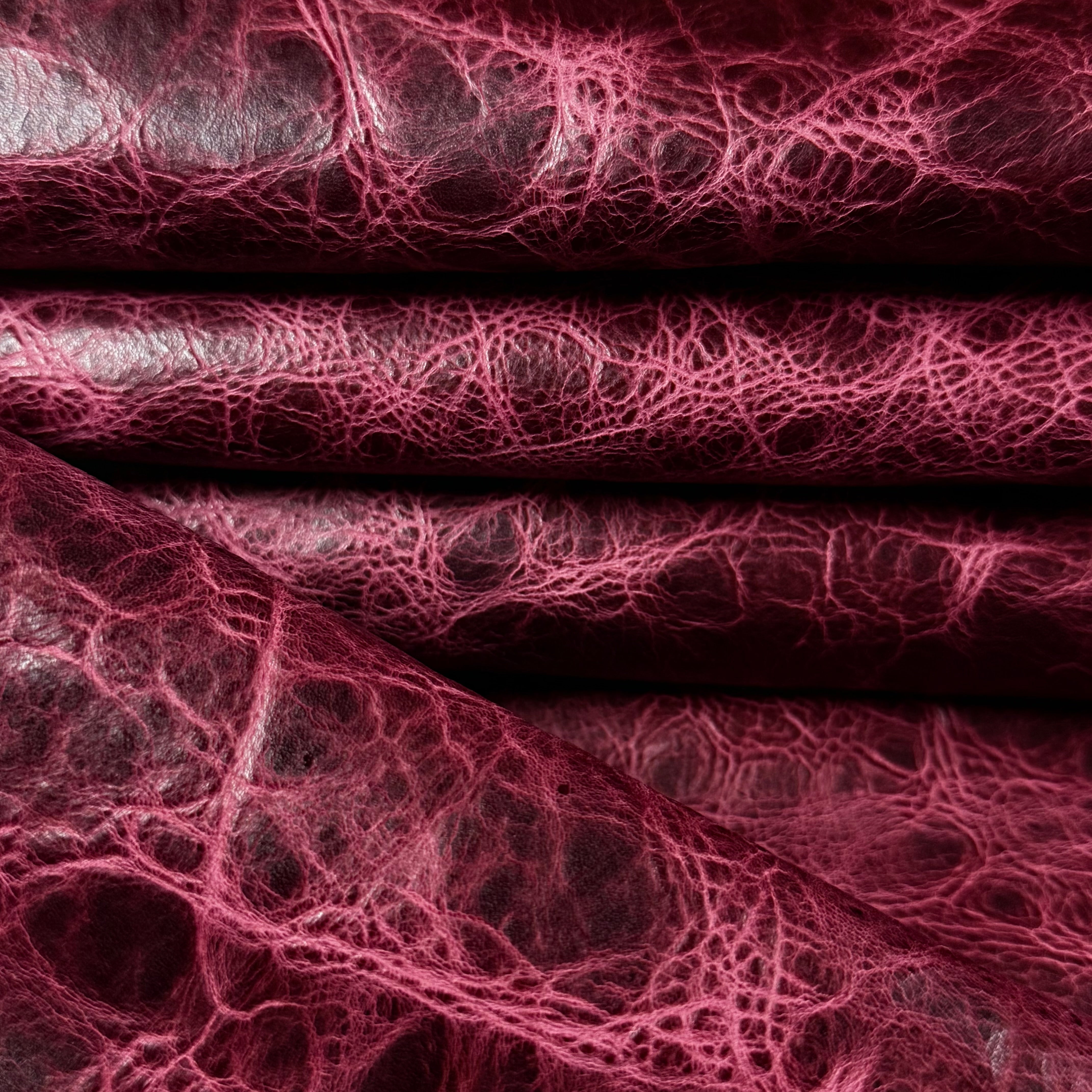 Burgundy Carnauba Waxed Pull-Up Cowhide, 2-3 oz leather with a rich, distressed texture and deep red finish.