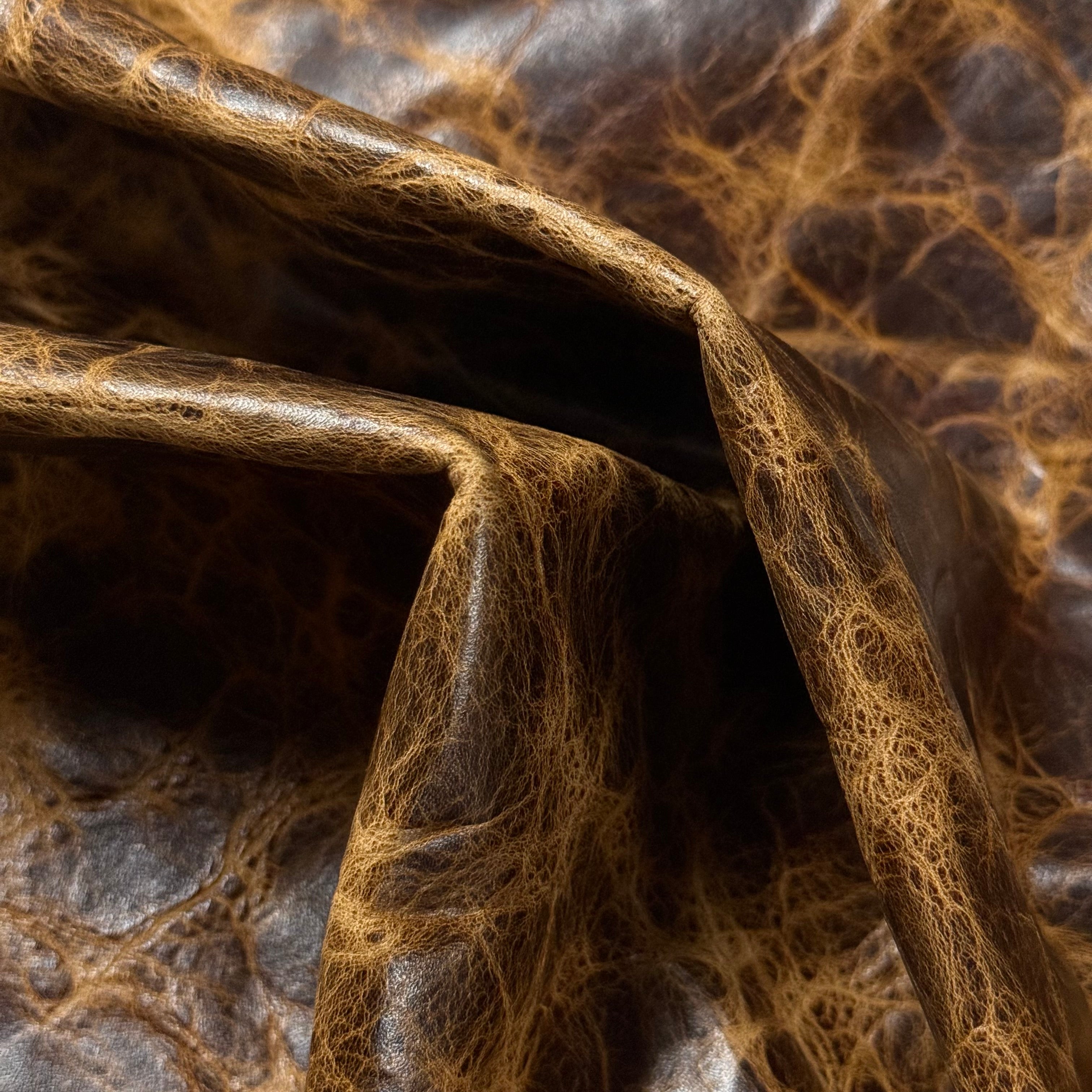 Brown Carnauba Waxed Pull-Up Cowhide leather, 2-3 oz, featuring a distressed, textured finish with natural light-brown creases.