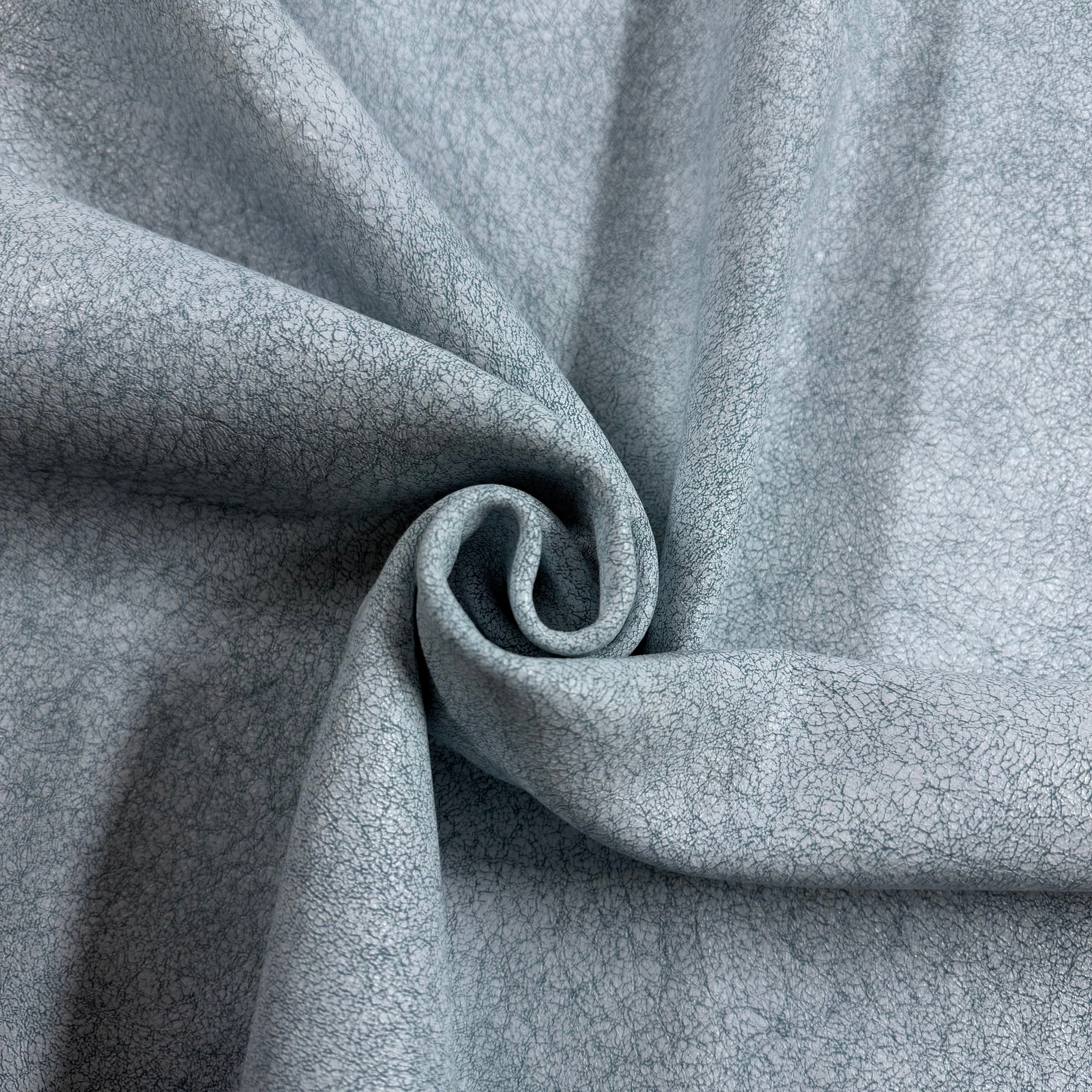 Crackle Leather in light blue, featuring a soft, draped fabric with a distinct distressed, textured finish.