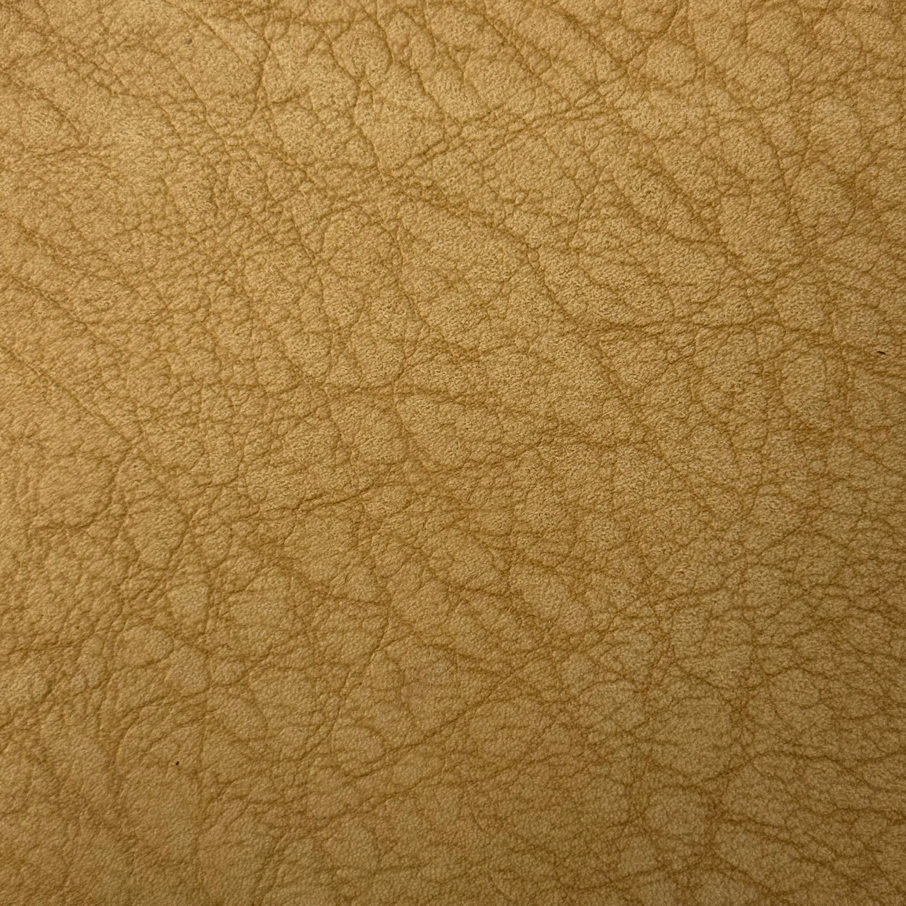 Tan Distressed Buffed Elephant Embossed Cowhide leather, 3 oz, featuring a textured, rugged grain pattern.